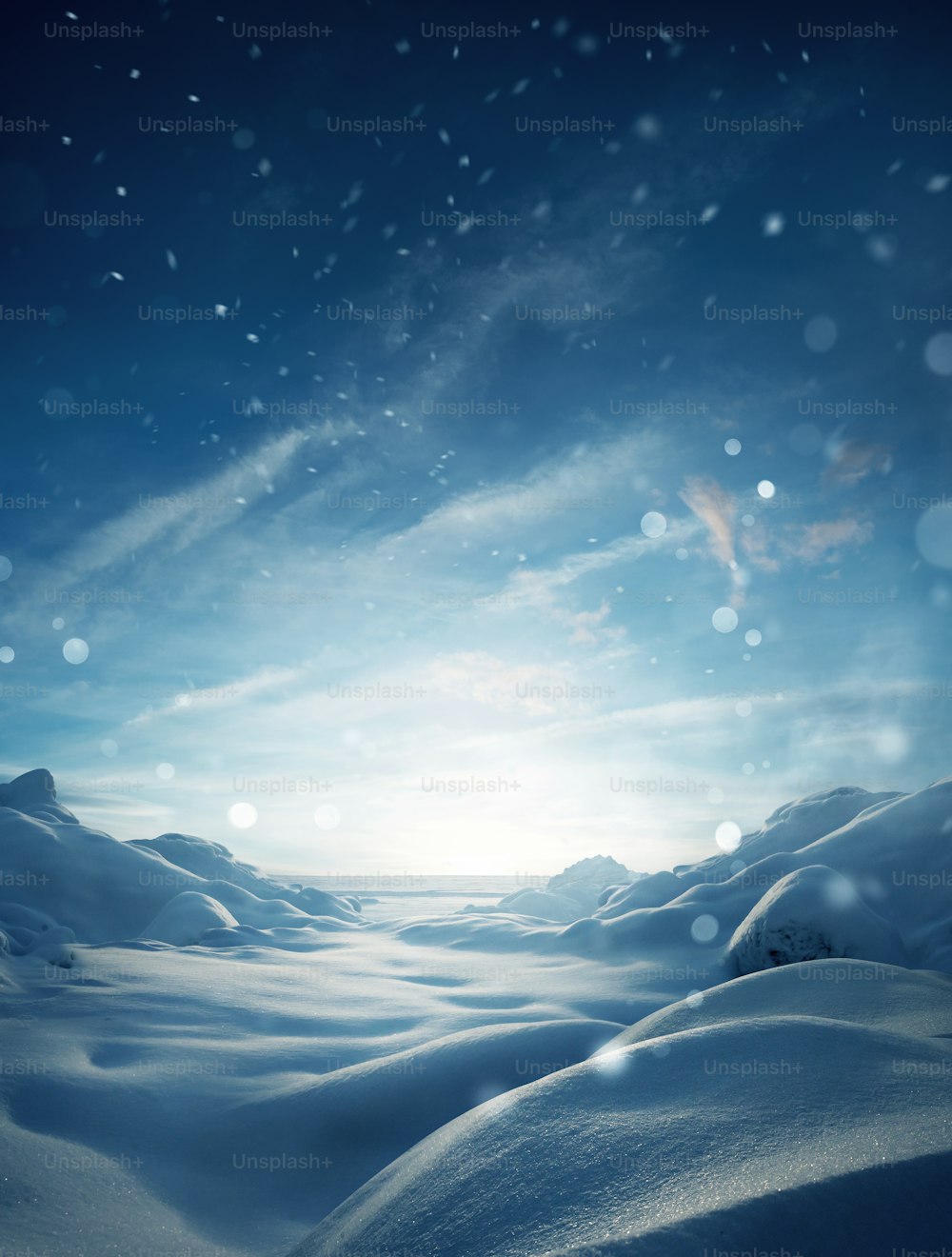 A mystical winter snow covered landscape christmas background with particles of snow falling.