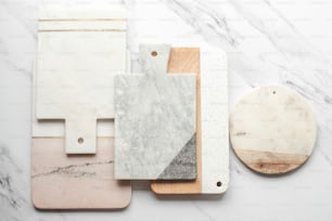 marble and wood cutting boards on a marble counter top