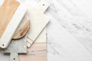 a marble counter top with a wooden cutting board