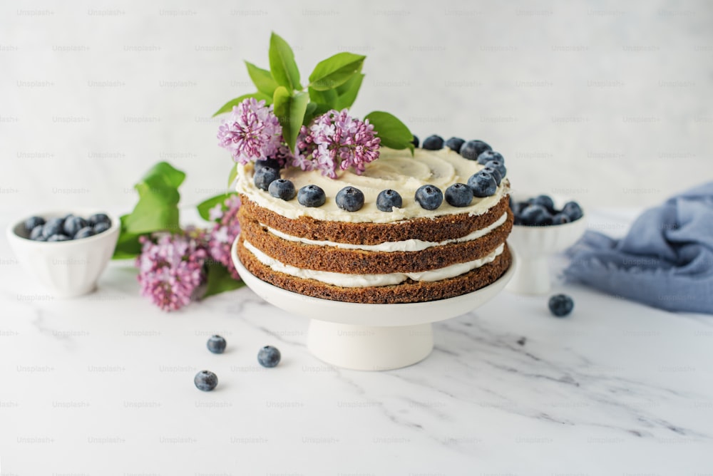 a cake sitting on top of a white cake plate