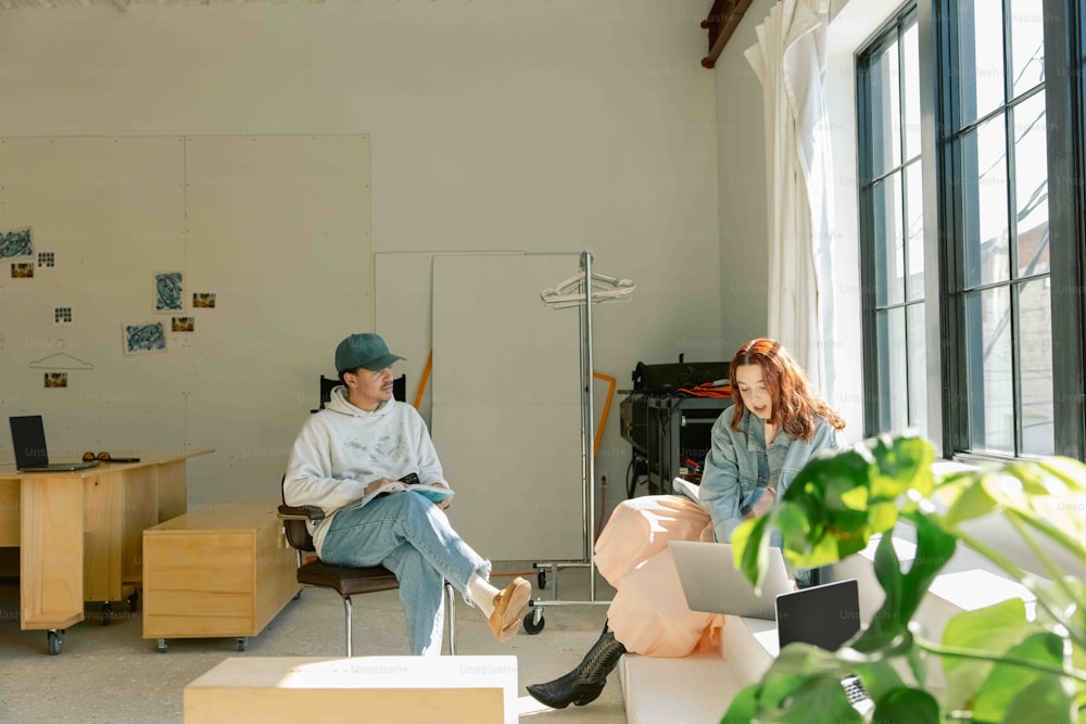 a man and a woman sitting in a room