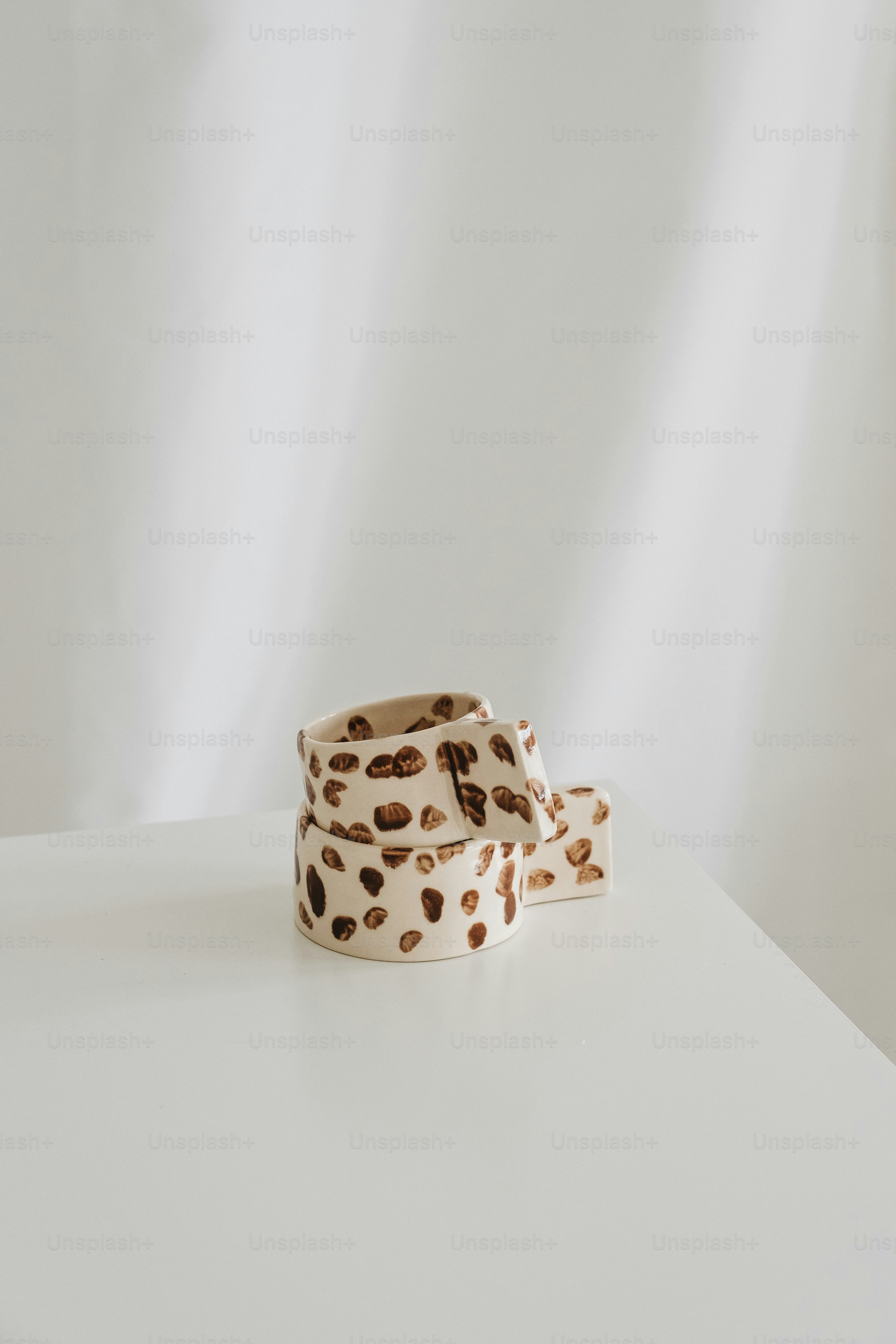 a pair of shoes sitting on top of a white table