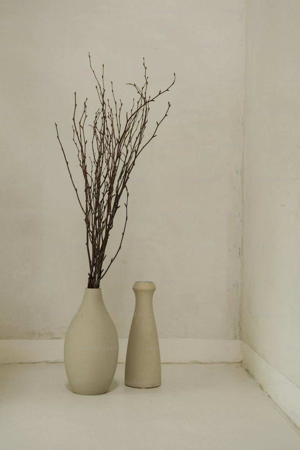 a couple of vases sitting next to each other