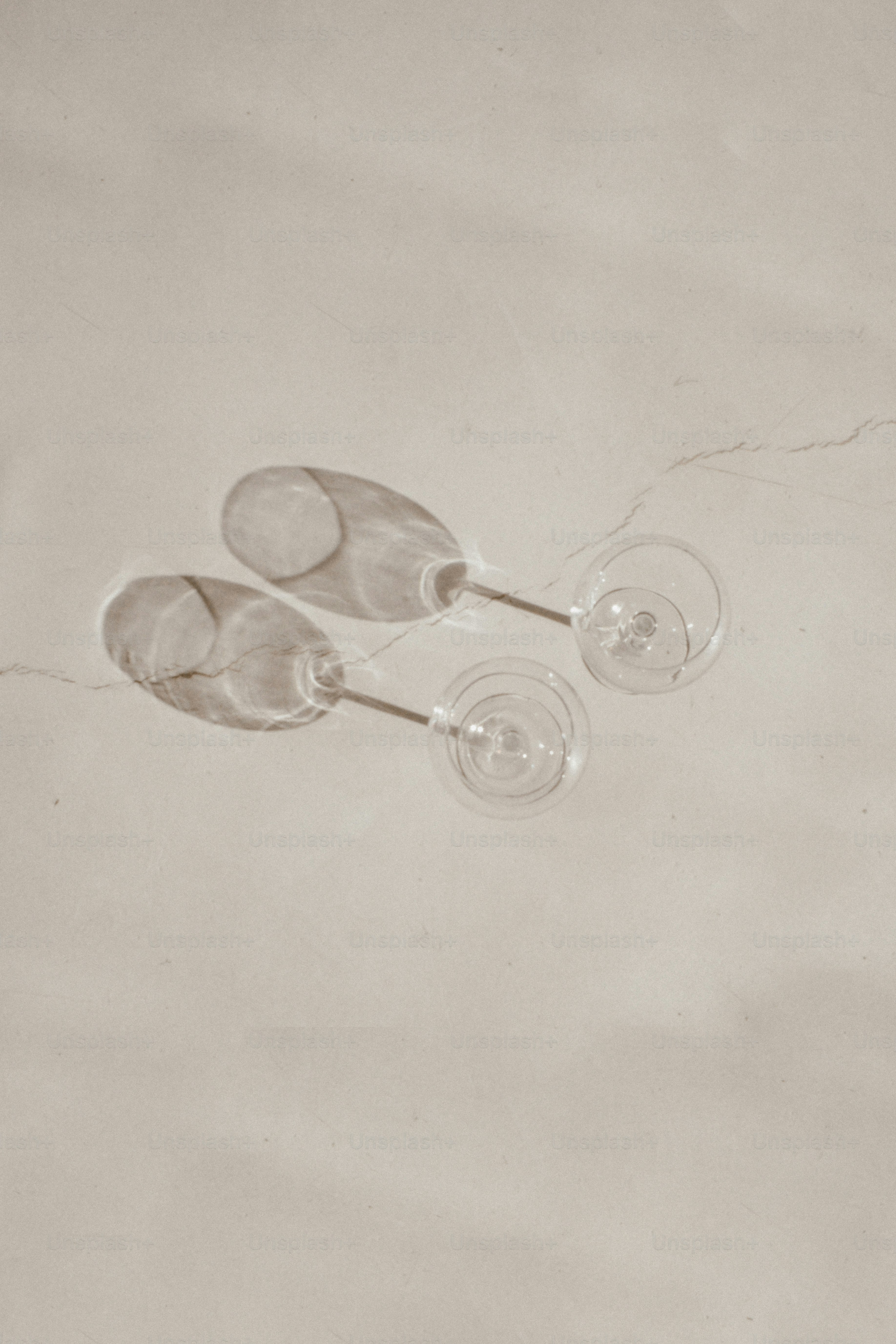 a couple of wine glasses sitting on top of a table