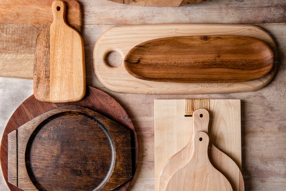a variety of wooden cutting boards and cutting boards