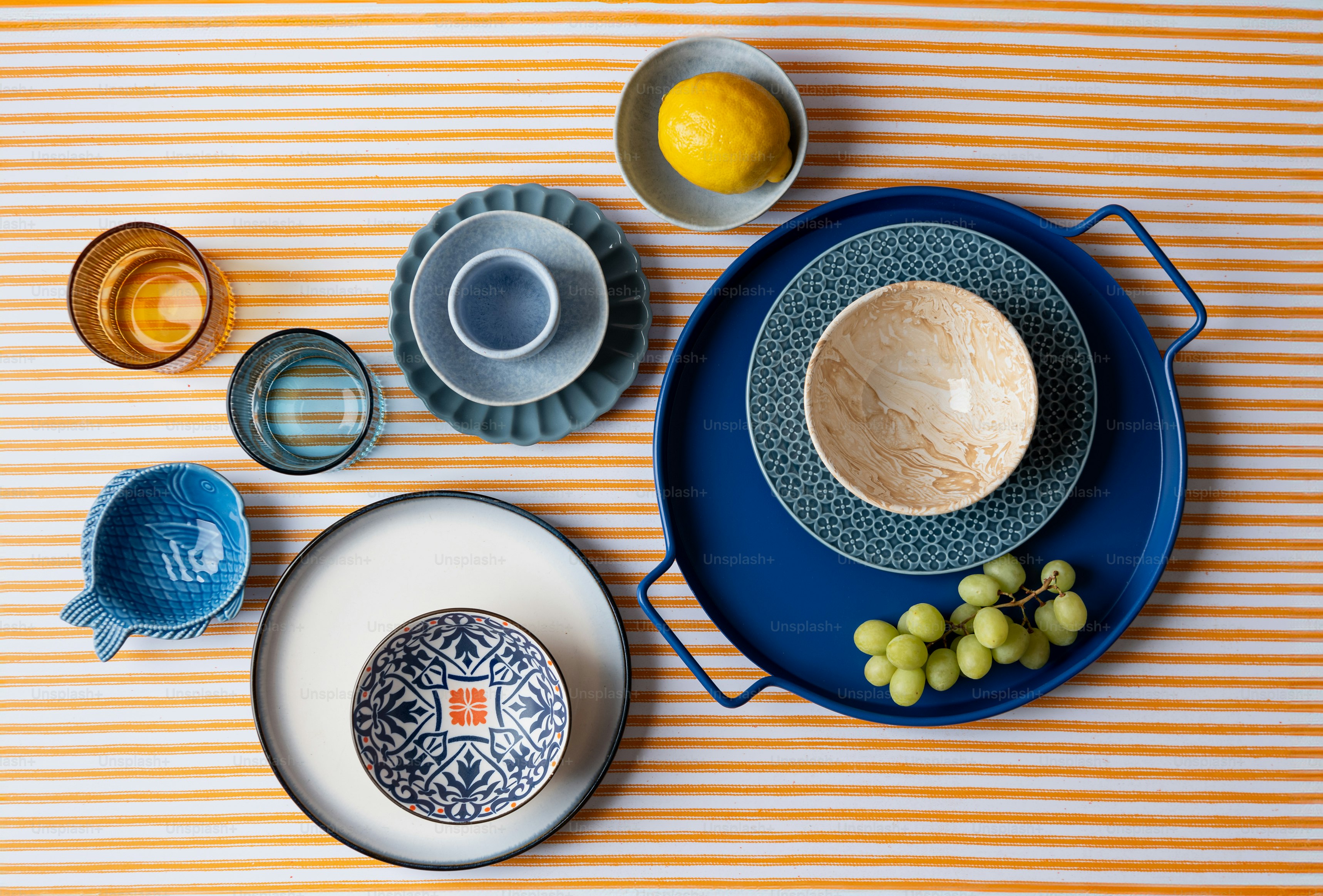 a table topped with plates and bowls filled with food