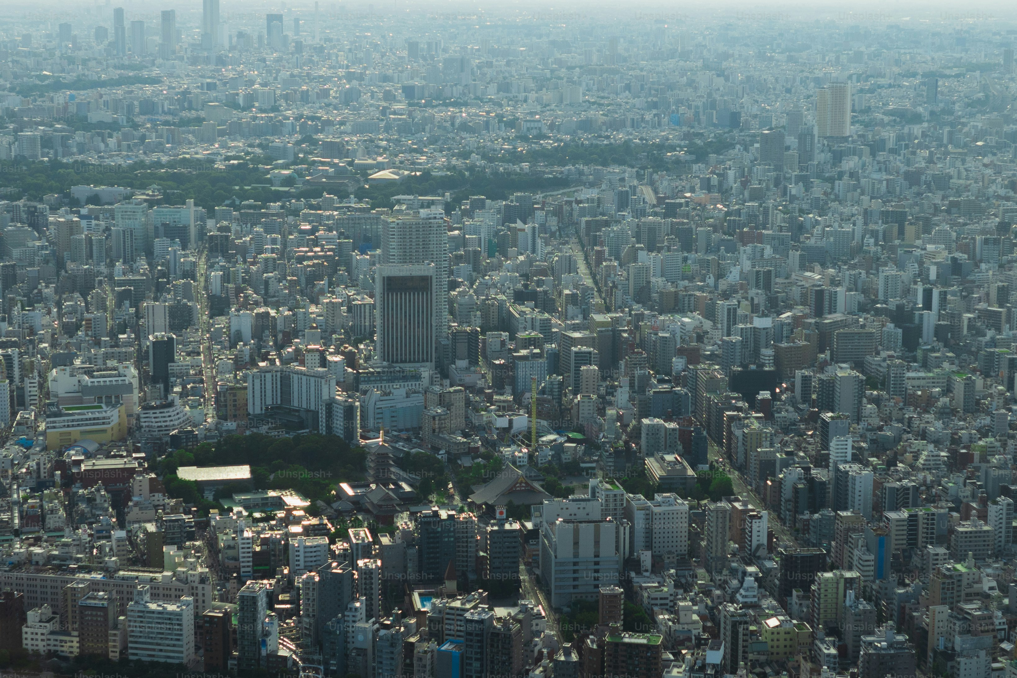 an aerial view of a city with tall buildings