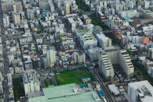 an aerial view of a city with lots of tall buildings