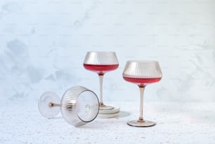 a couple of wine glasses sitting on top of each other