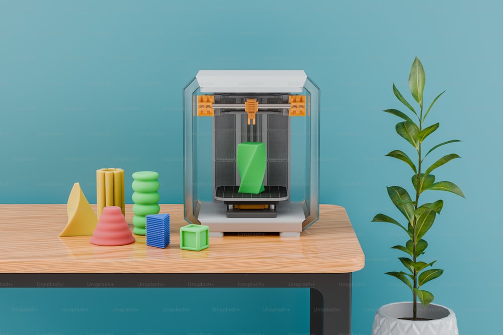 Uma impressora 3D sentada em cima de uma mesa ao lado de um vaso de planta