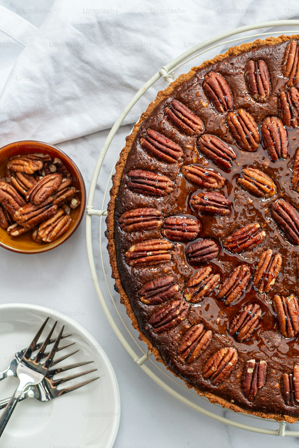 a chocolate pie with pecans on top of it