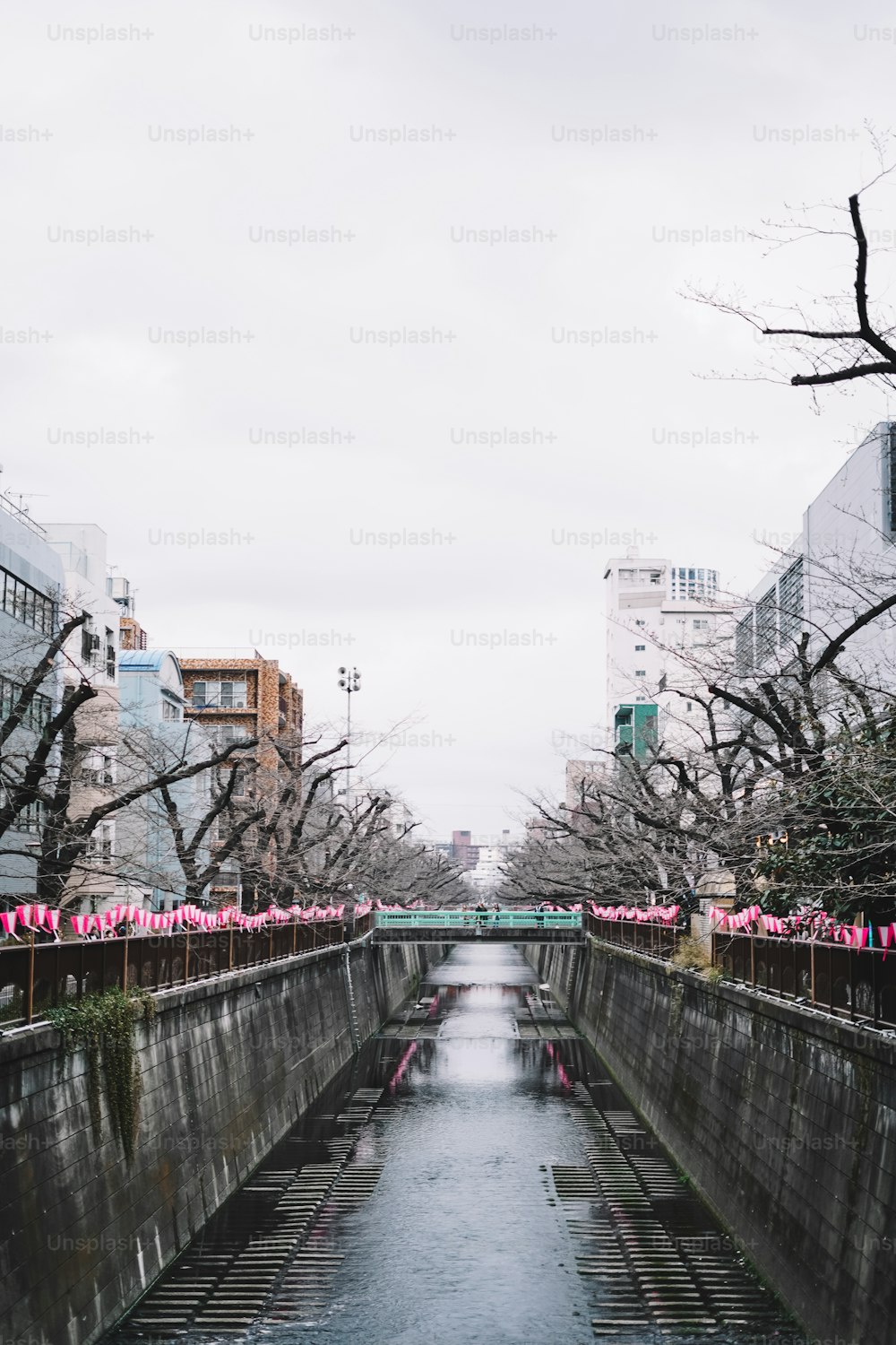 a river running through a city surrounded by tall buildings