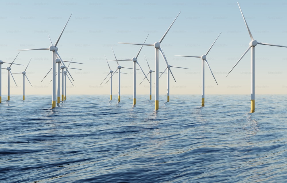 a row of wind turbines floating on top of a body of water
