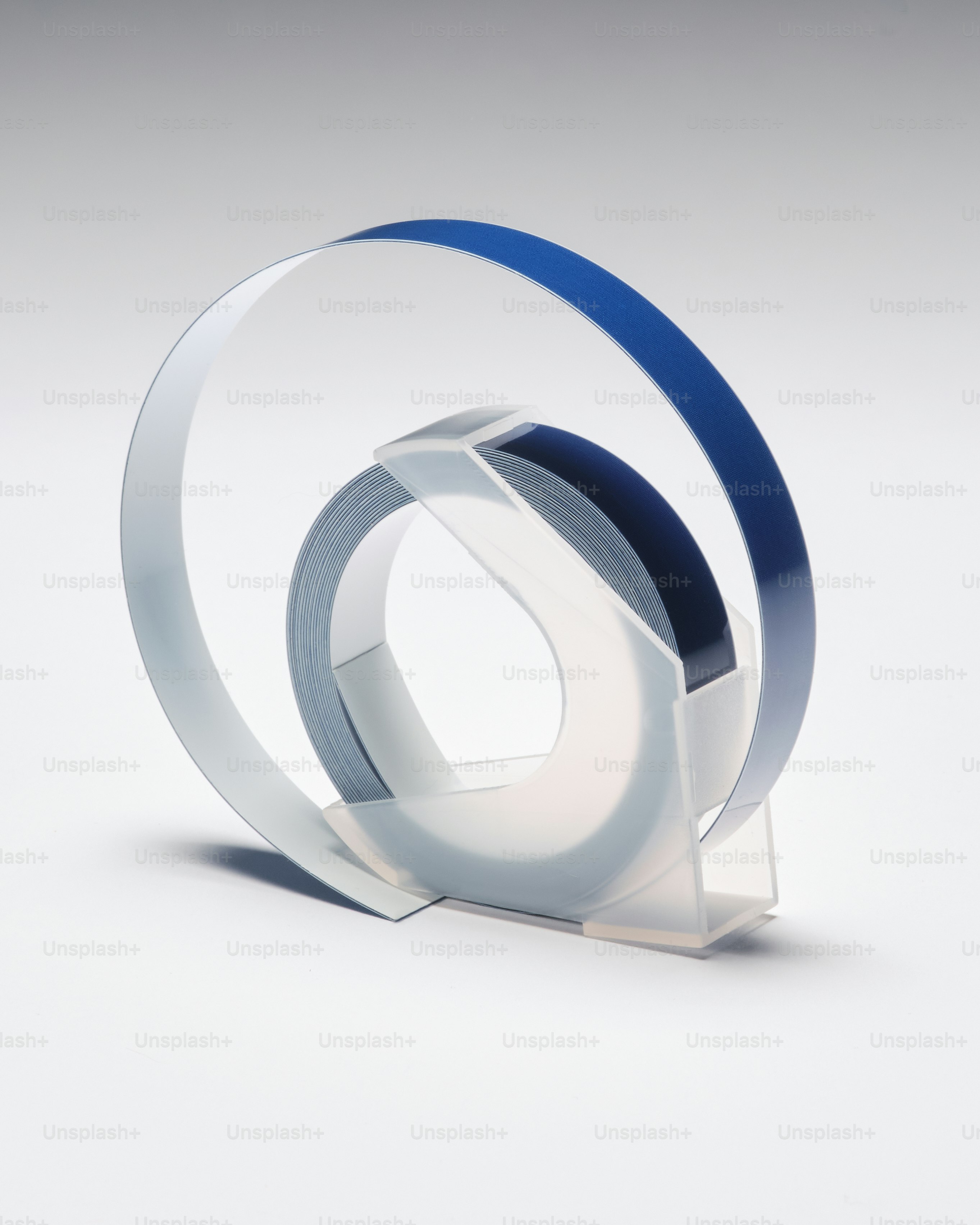 a white and blue object on a white surface