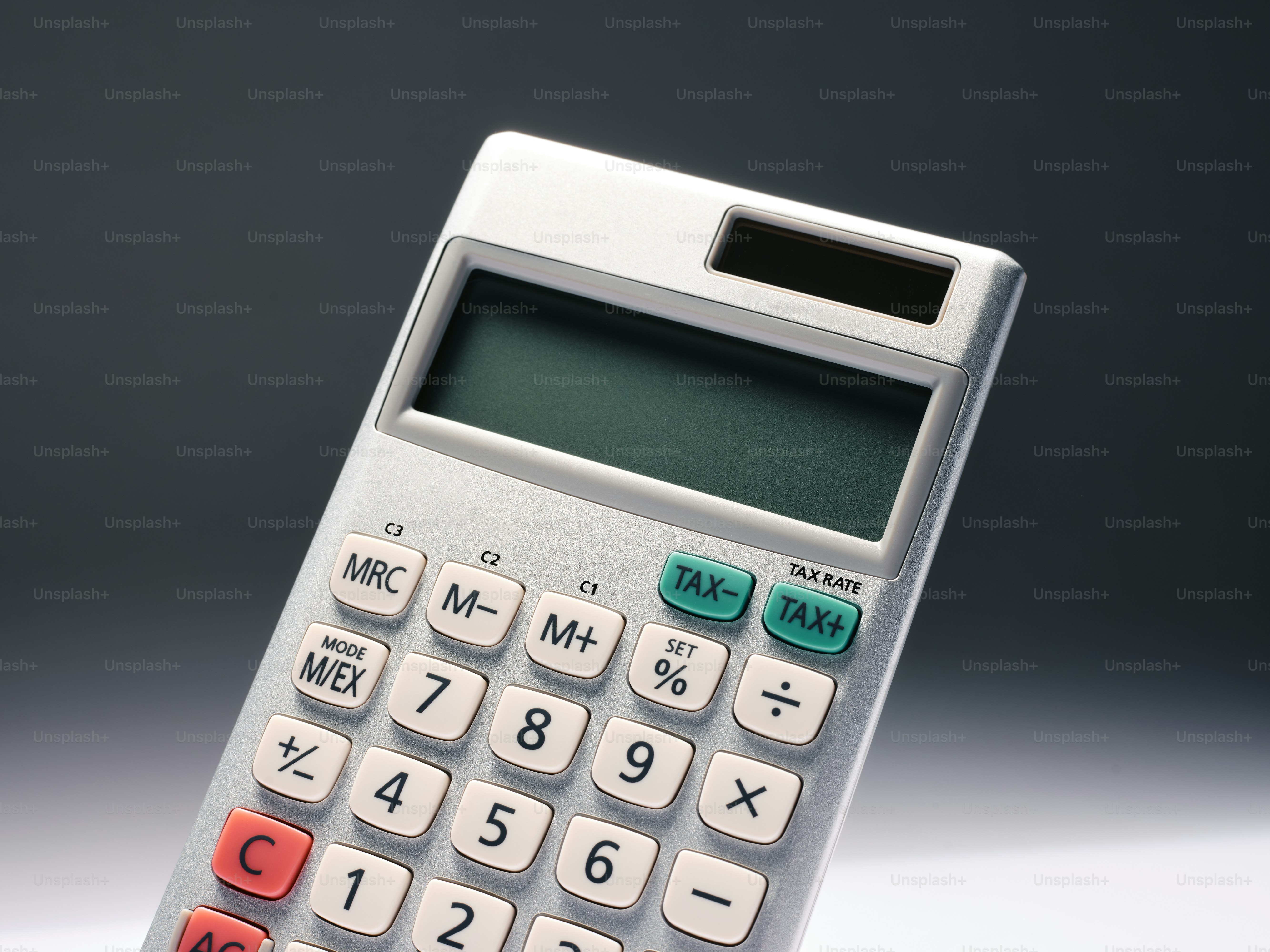 a close up of a calculator on a table