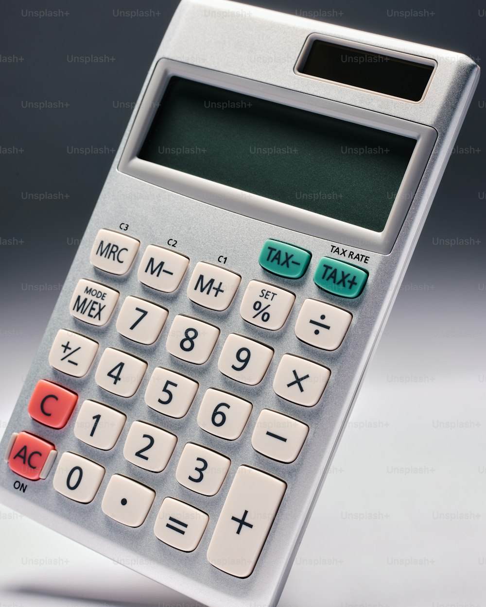 a close up of a calculator on a table