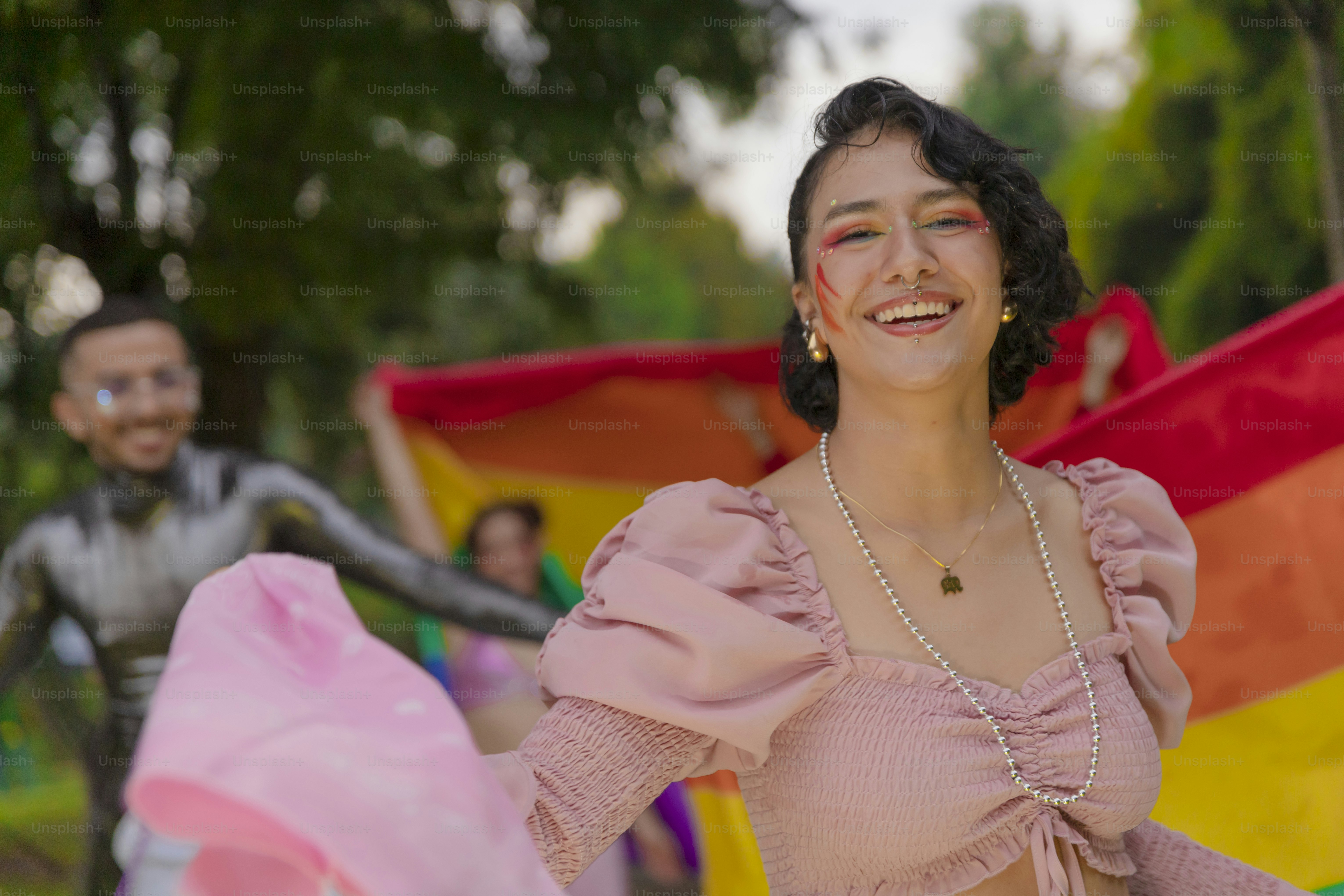 a woman in a pink top and a man in a costume