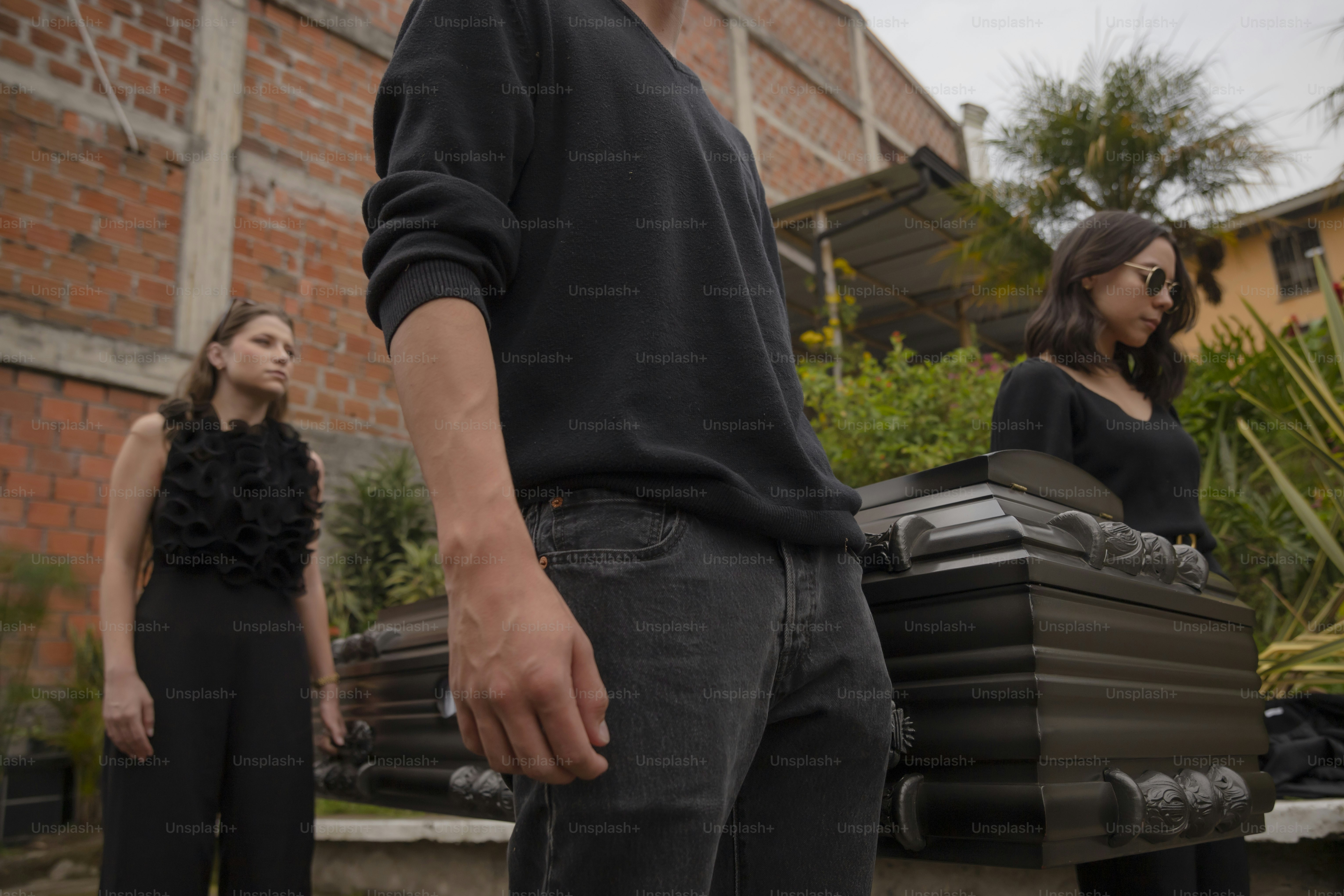 a man standing next to a woman holding a suitcase