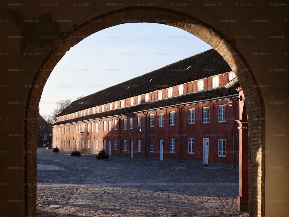 a large brick building with an arched doorway