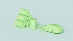 um pequeno carro de brinquedo sentado ao lado de uma pilha de papel higiênico enrolado