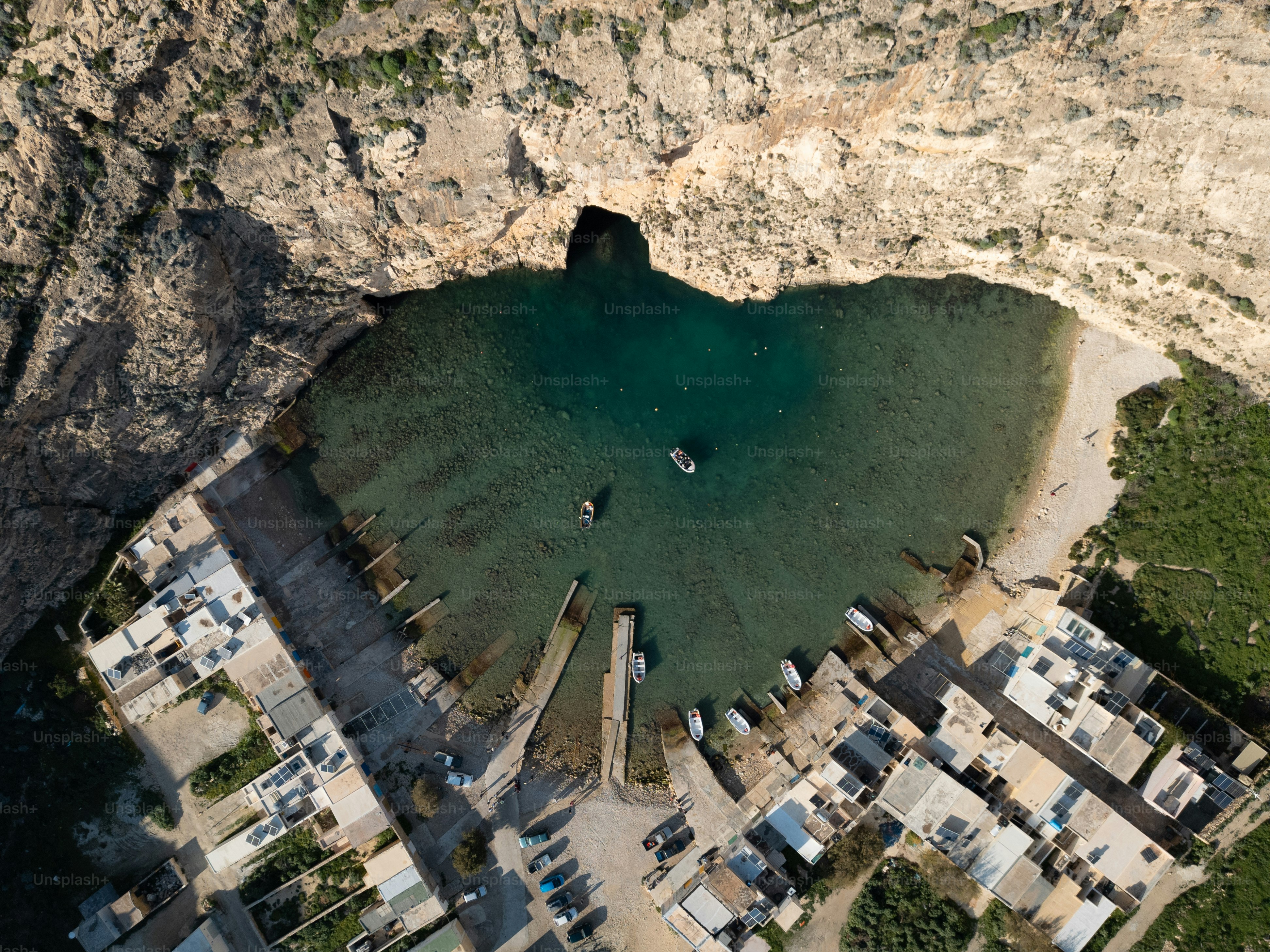 an aerial view of a lake surrounded by buildings
