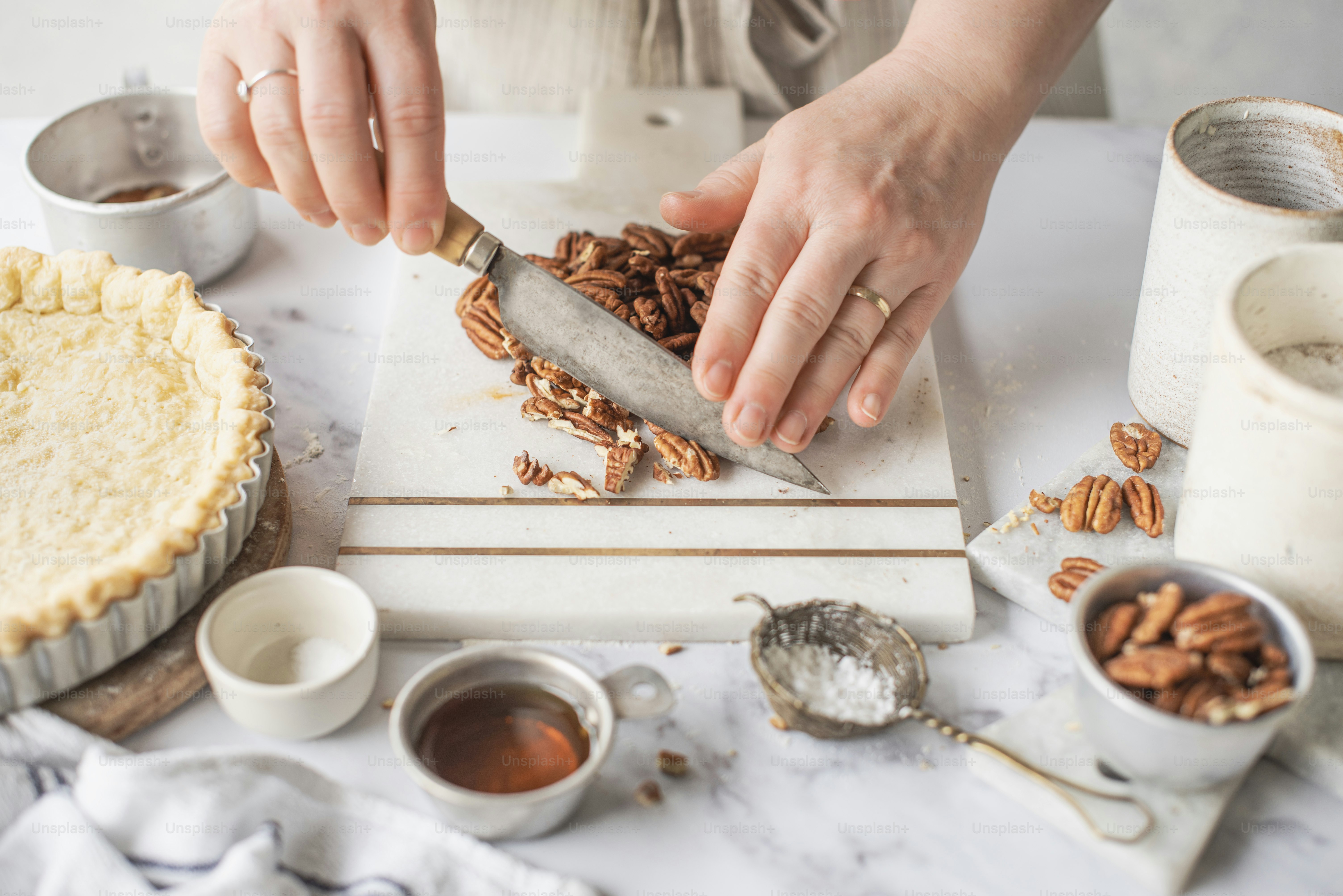 a person is cutting up some food on a cutting board