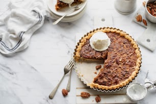 a pecan pie with a slice taken out of it