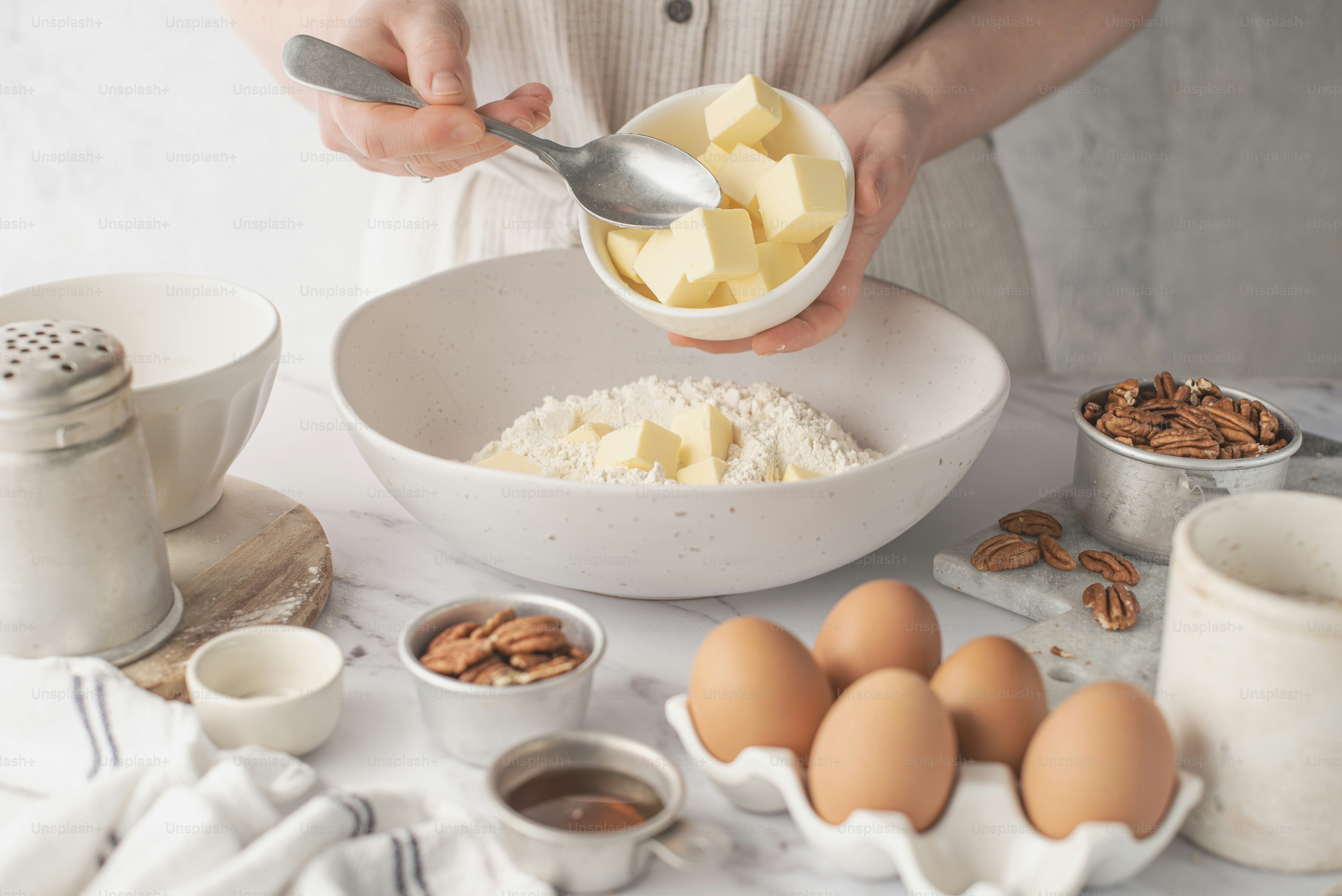 a person is mixing ingredients in a bowl