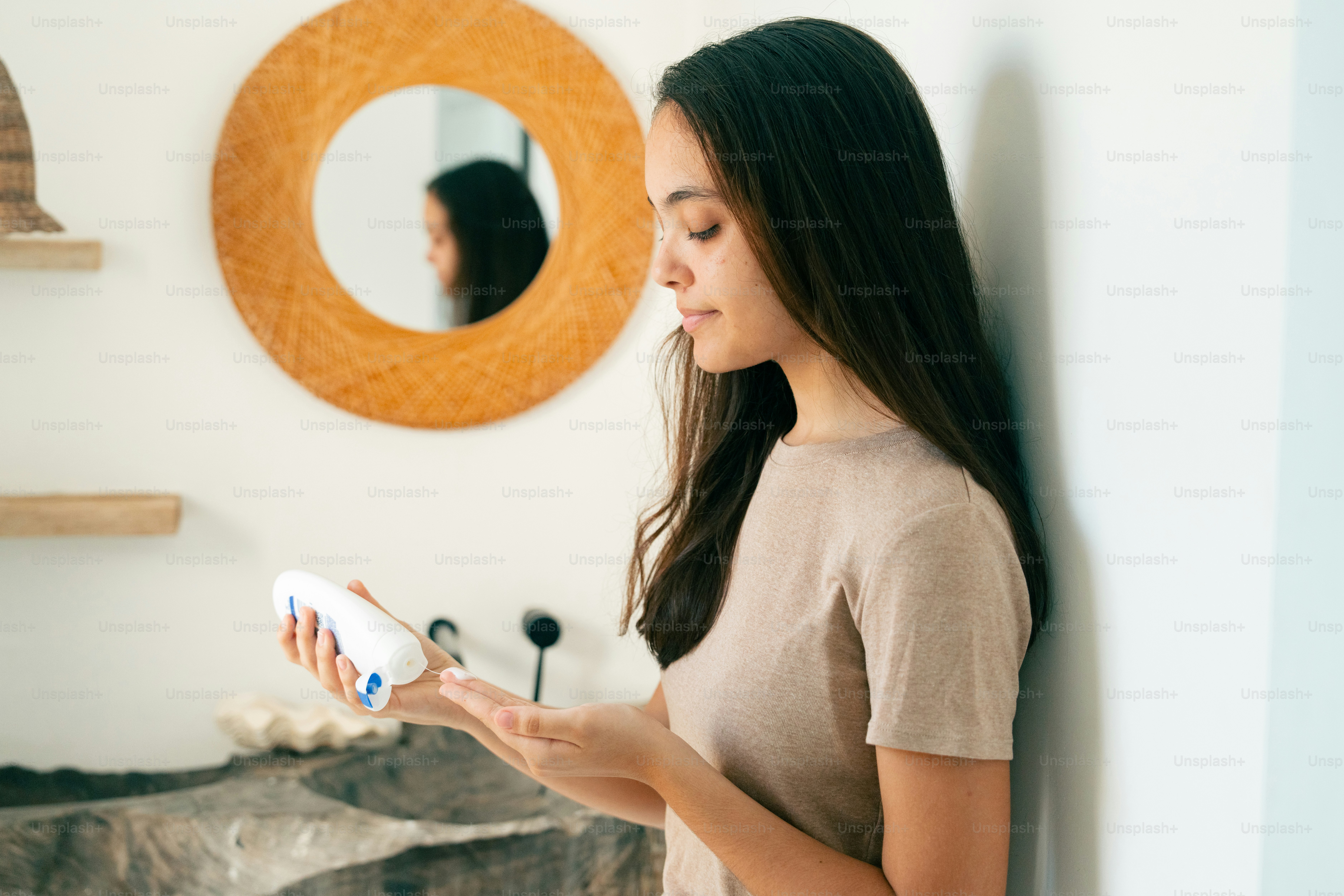 a woman holding a hair dryer in her hand