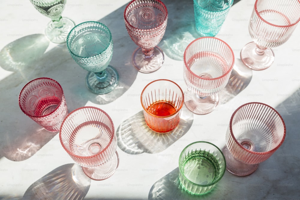 a group of colorful glasses sitting on top of a table