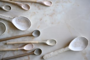 a bunch of spoons that are on a table