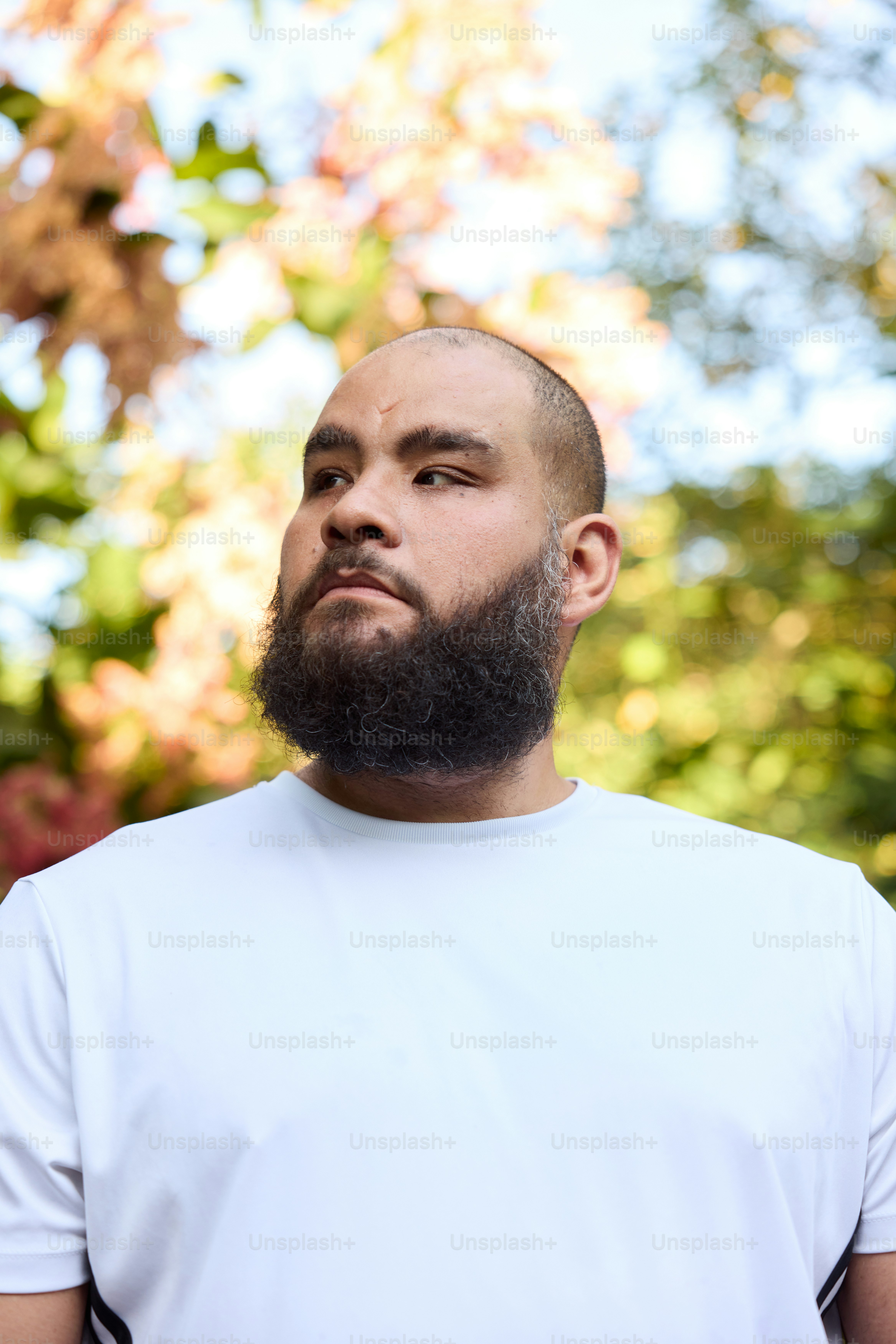 a man with a beard and a white shirt