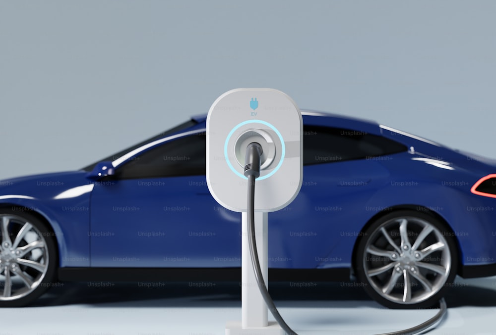 a blue car plugged in to a charger