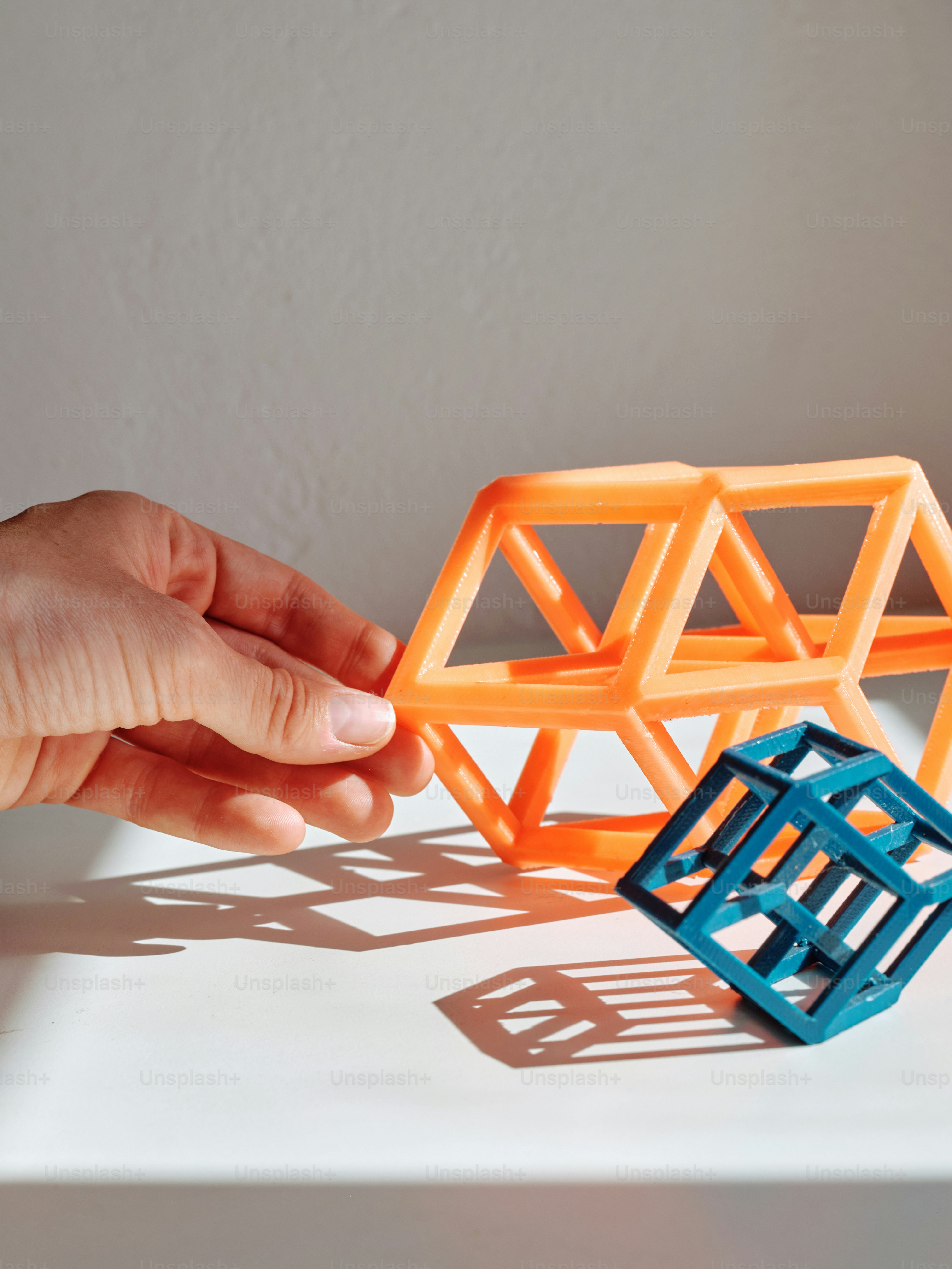 a person holding a plastic object in their hand