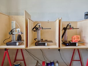 a couple of shelves that have some kind of machines on them
