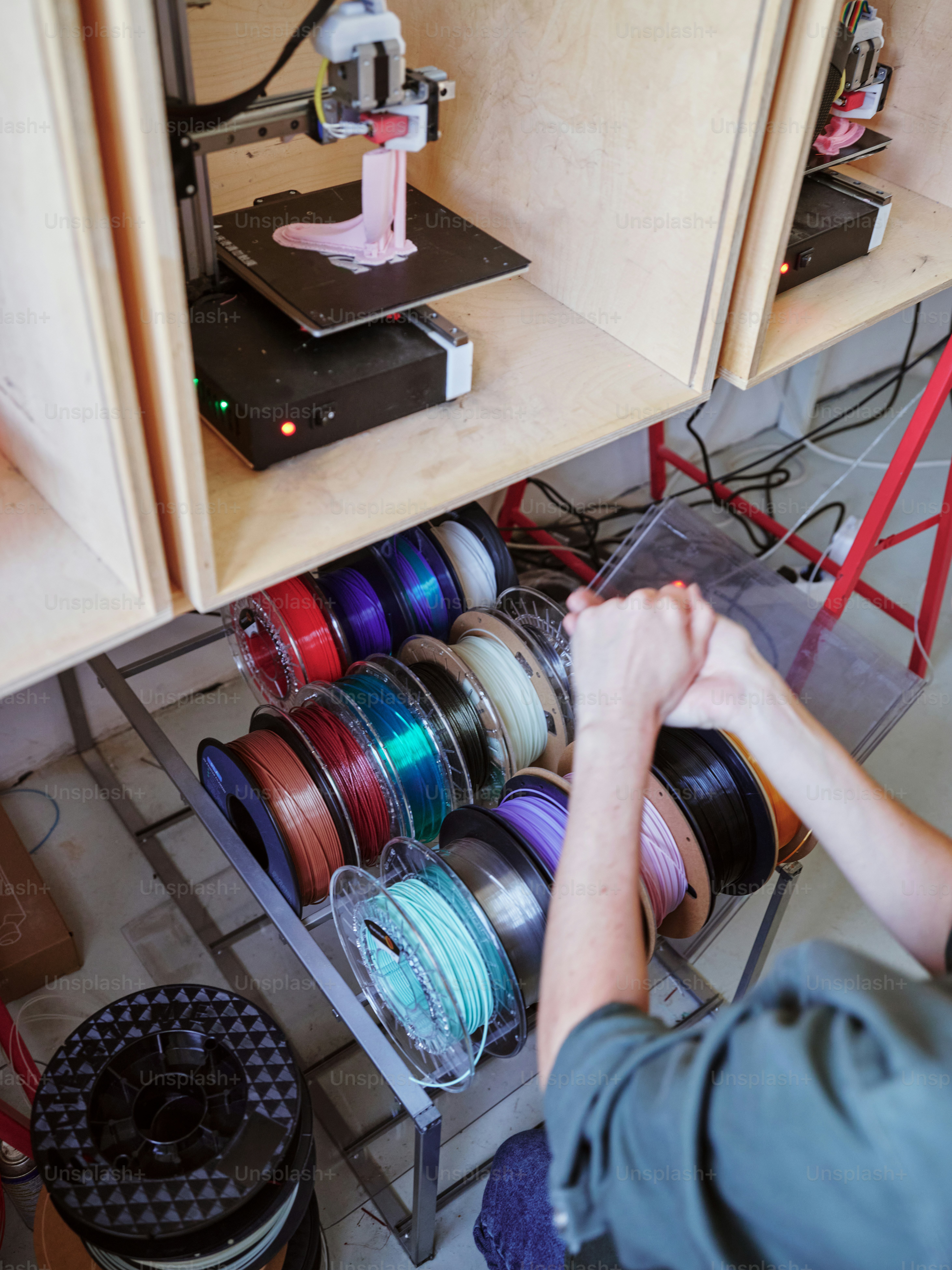 a person working on a machine in a room