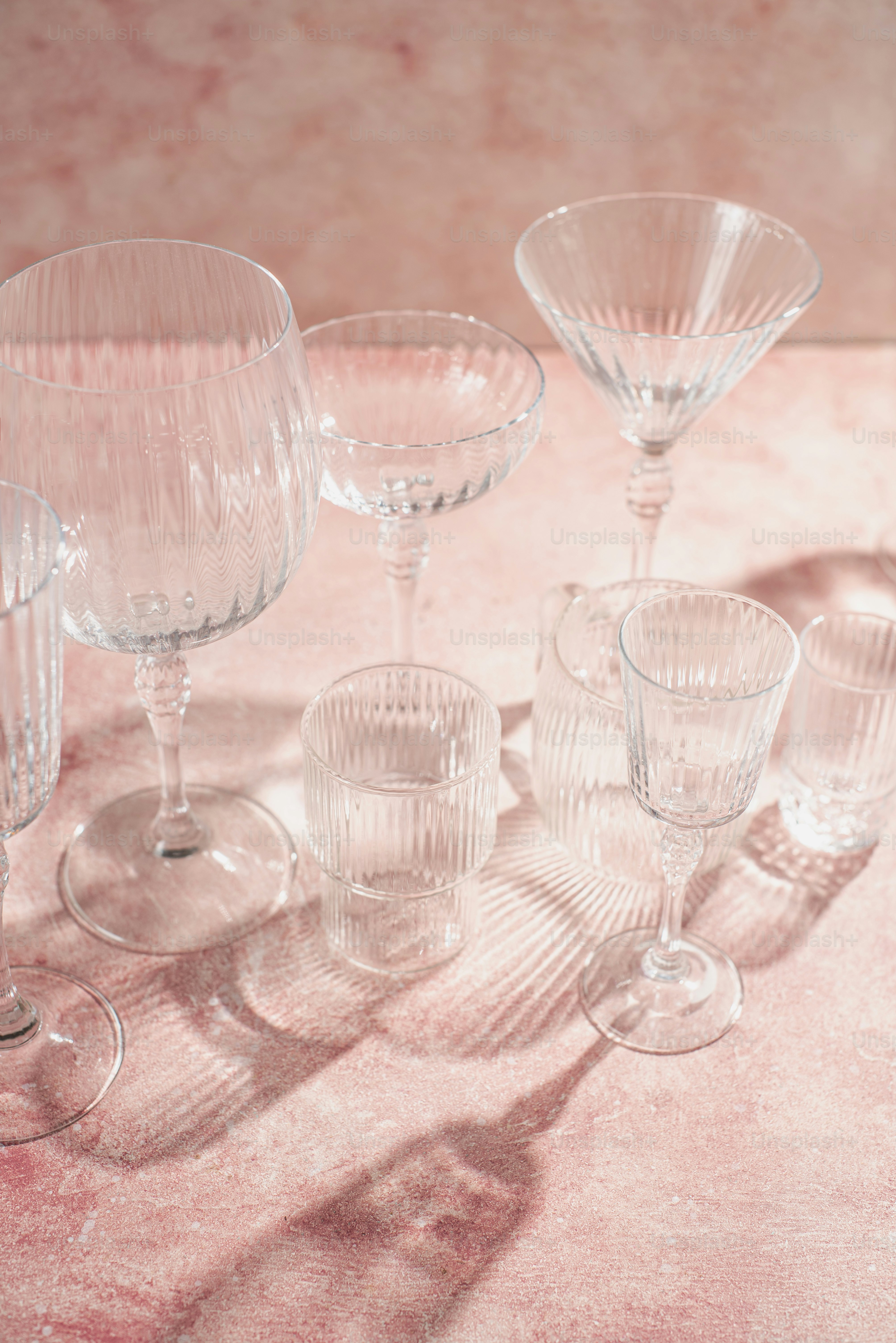 a group of wine glasses sitting on top of a table