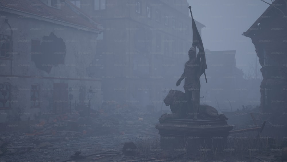 a statue in the middle of a street in a foggy day