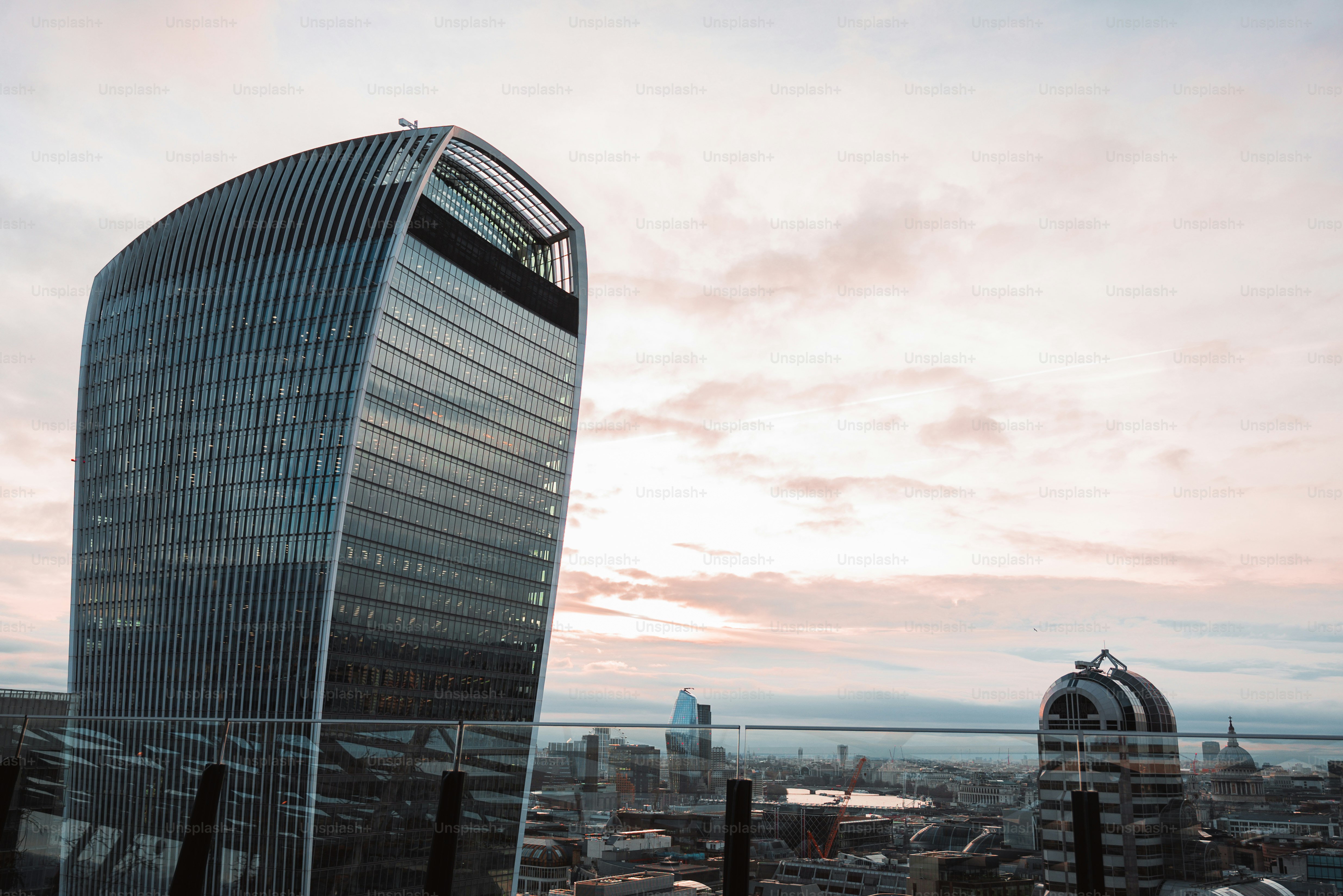 a tall building sitting next to a tall glass building