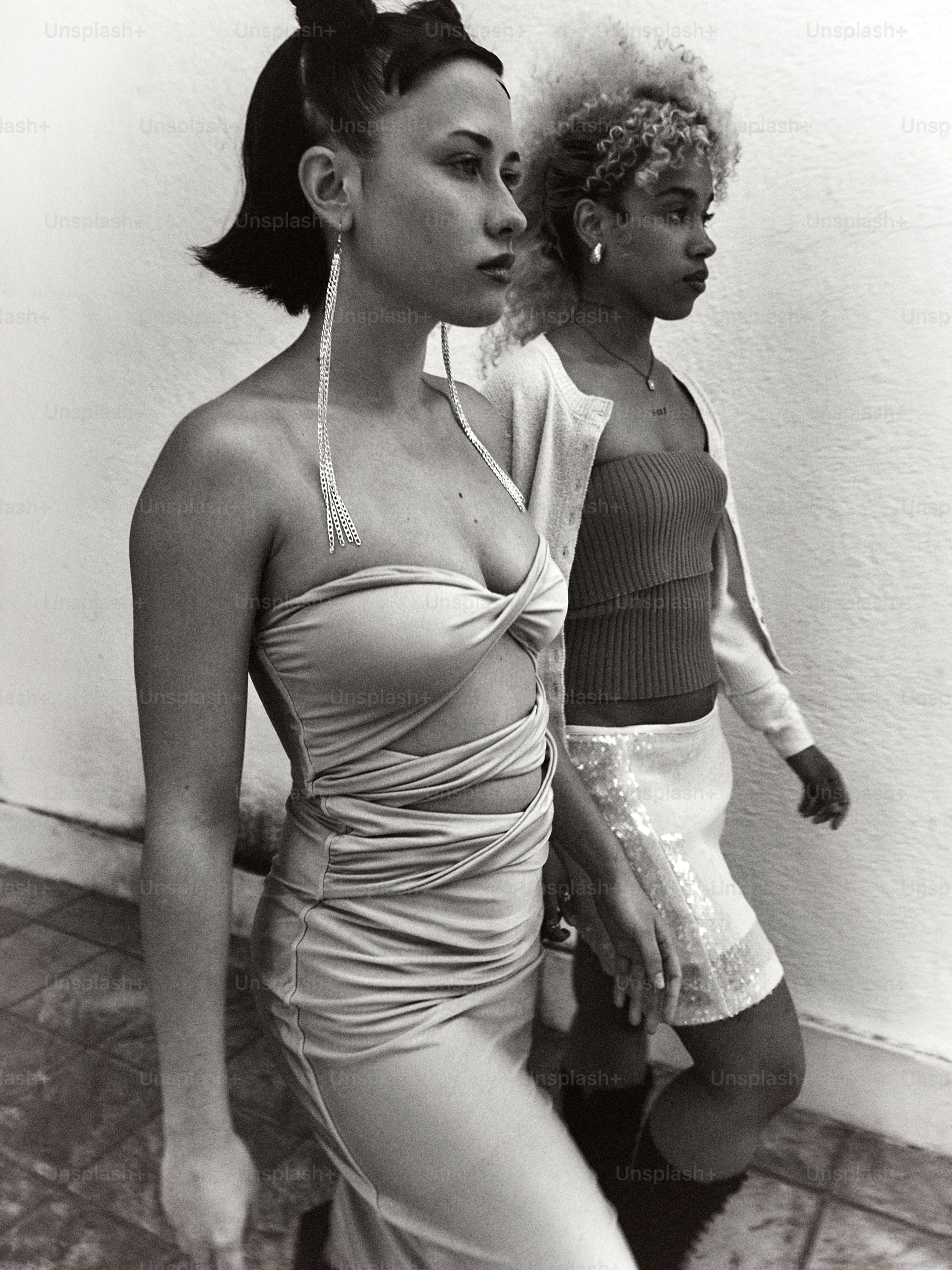 a black and white photo of two women