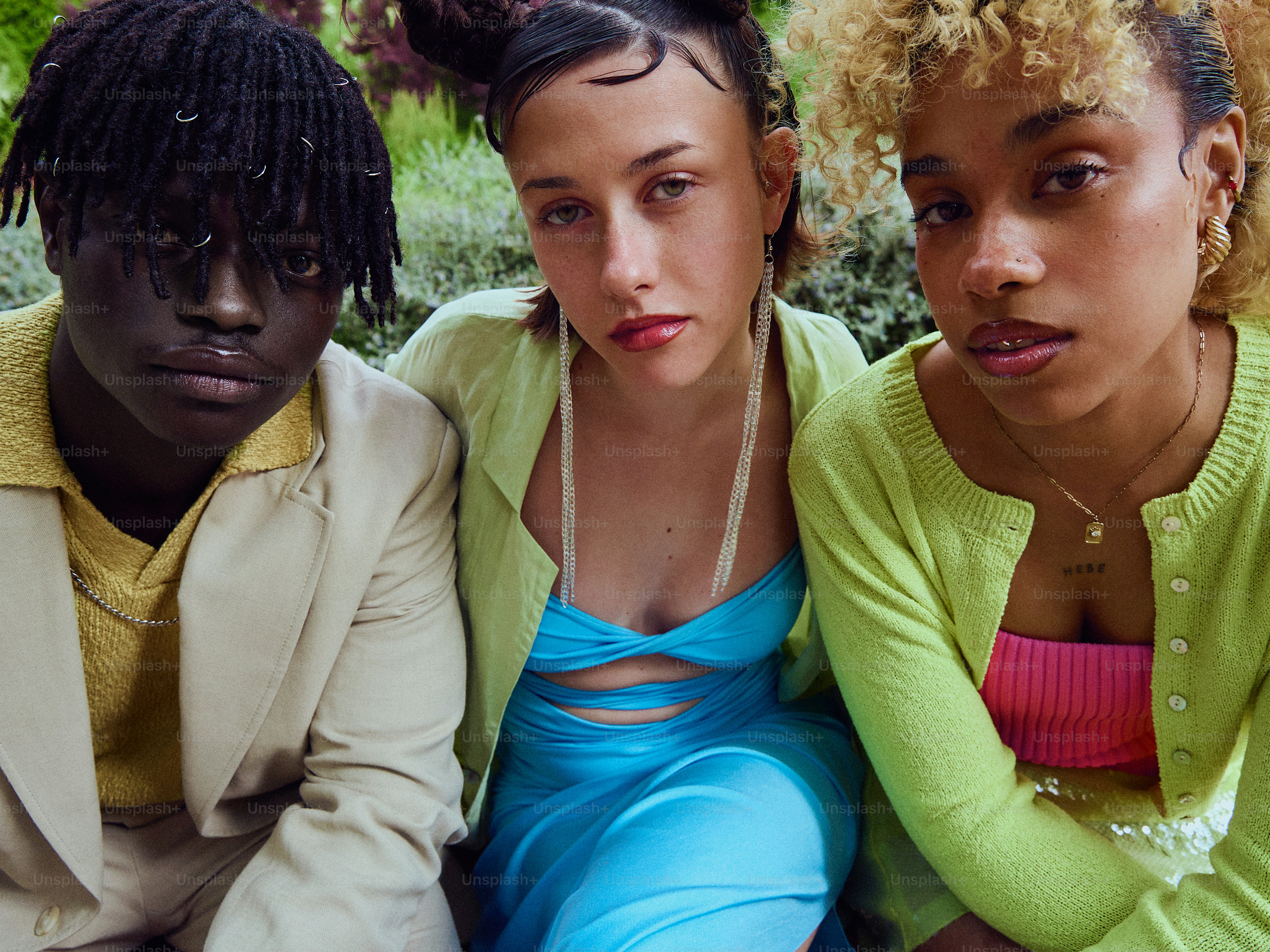 a group of three women sitting next to each other