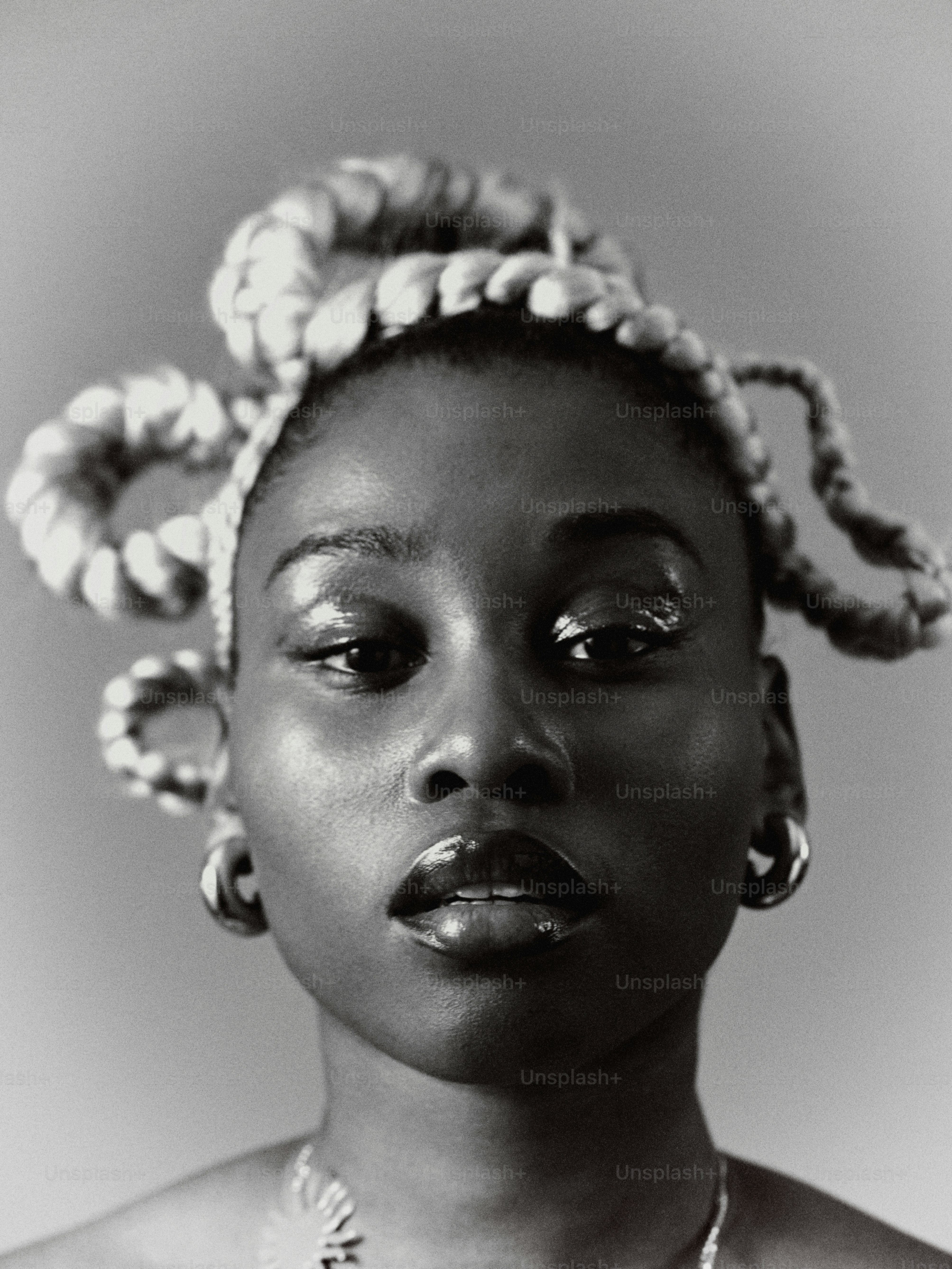 a woman with a necklace and a necklace on her neck