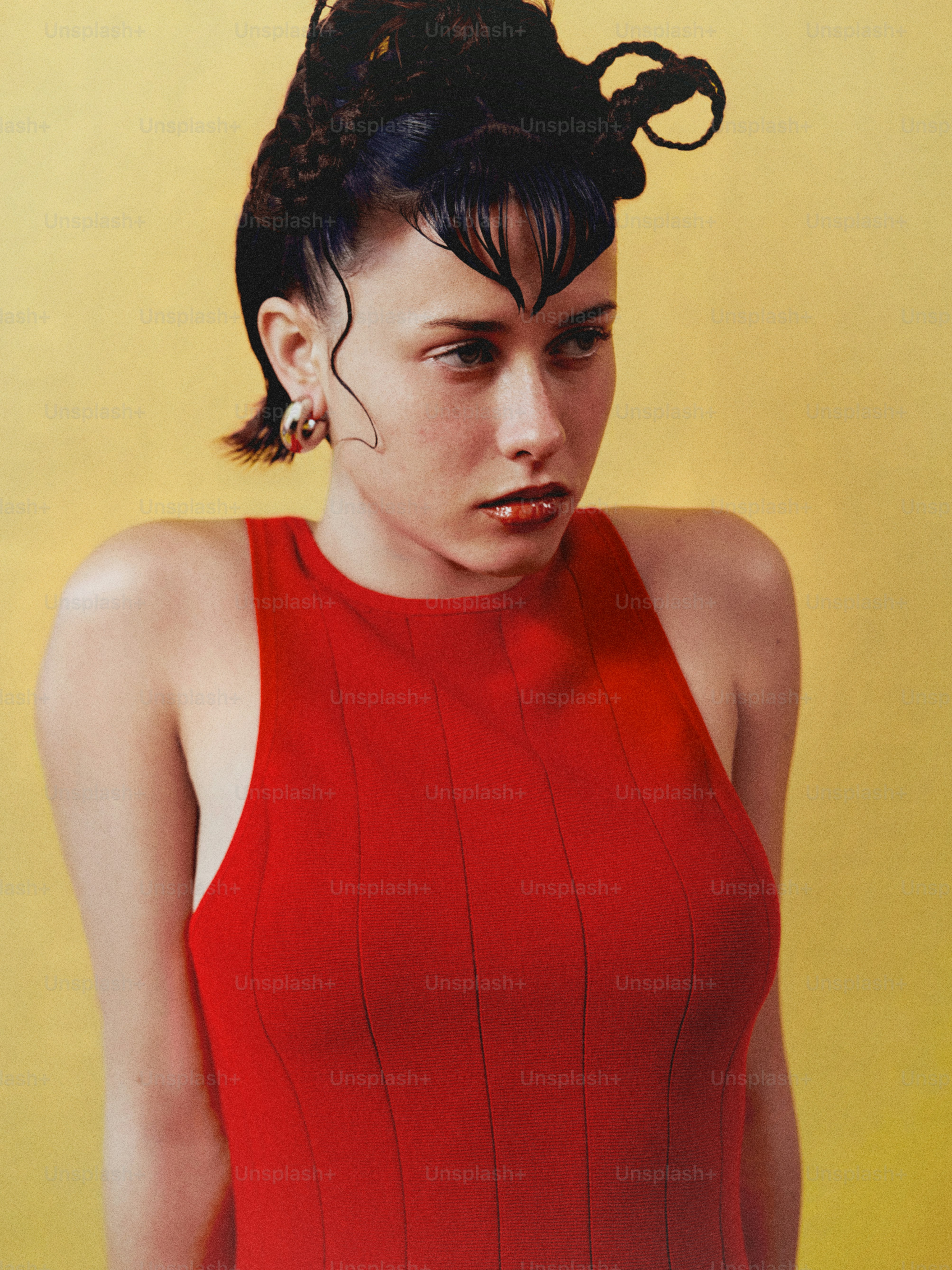 a woman in a red dress is posing for a picture