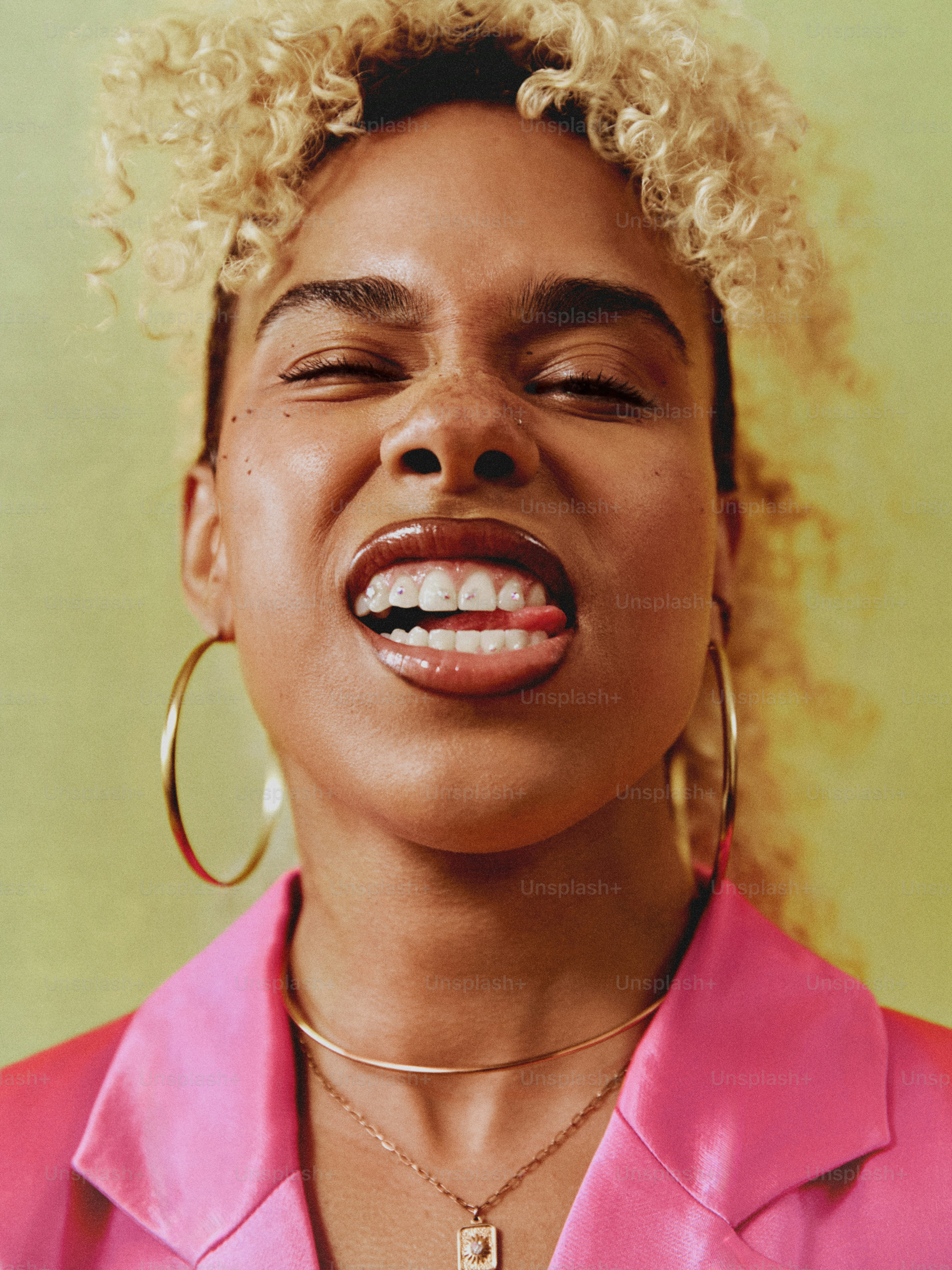 a close up of a person with a necklace