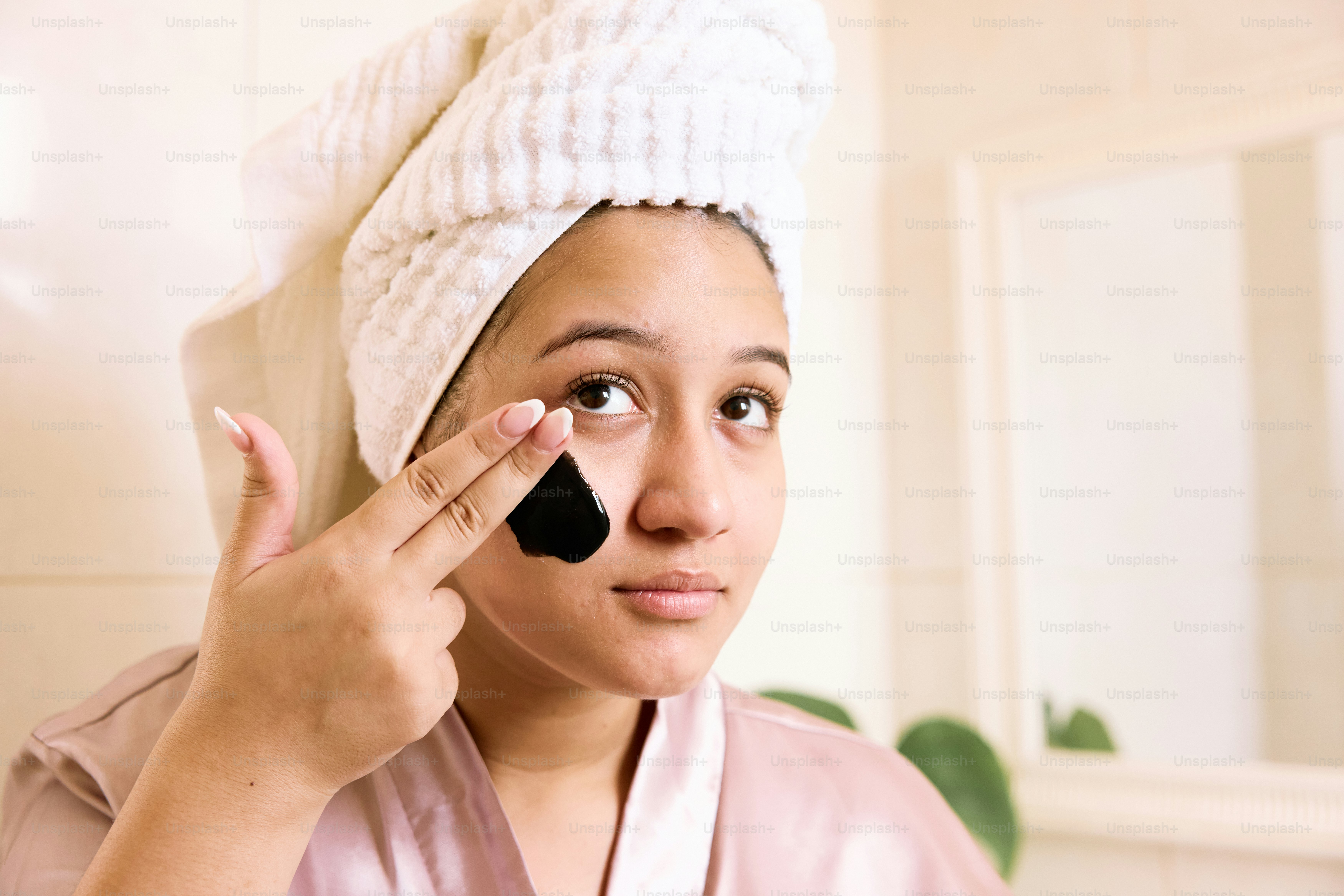 a woman with a towel on her head and a towel on her head
