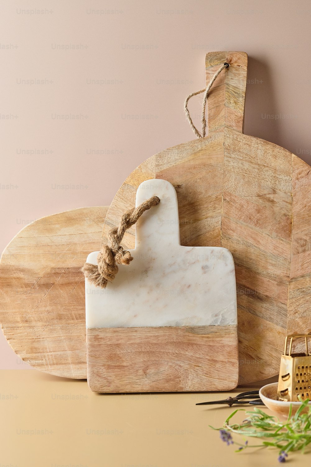 a wooden cutting board with a rope on top of it