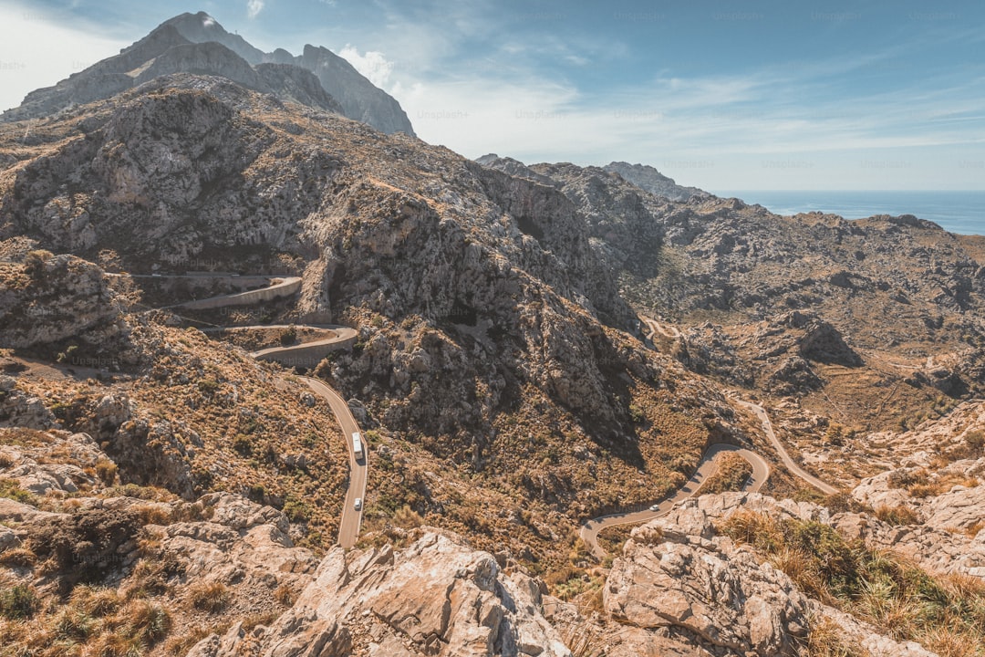 a mountain with a winding road in the middle of it