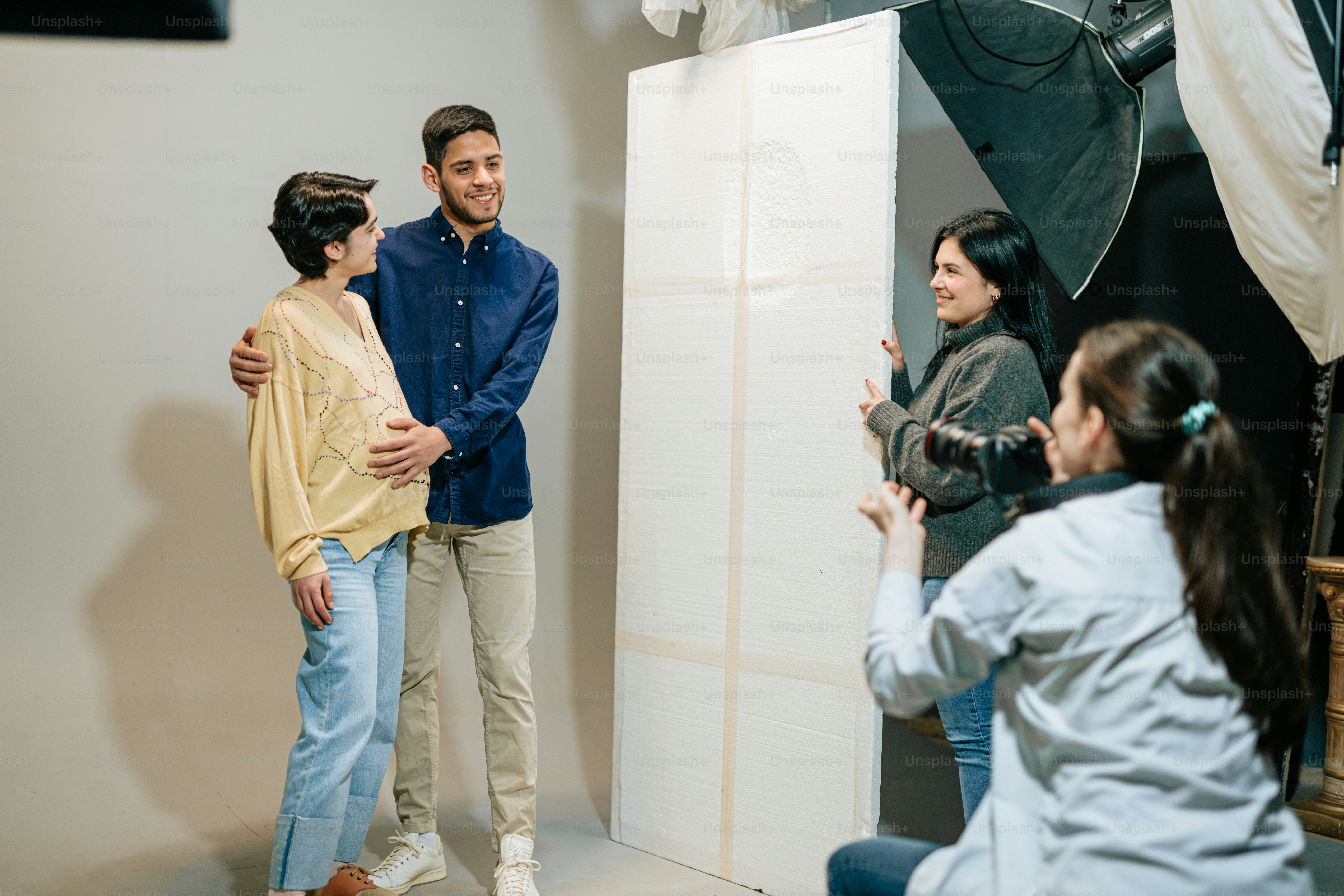 a couple of people that are standing in front of a mirror