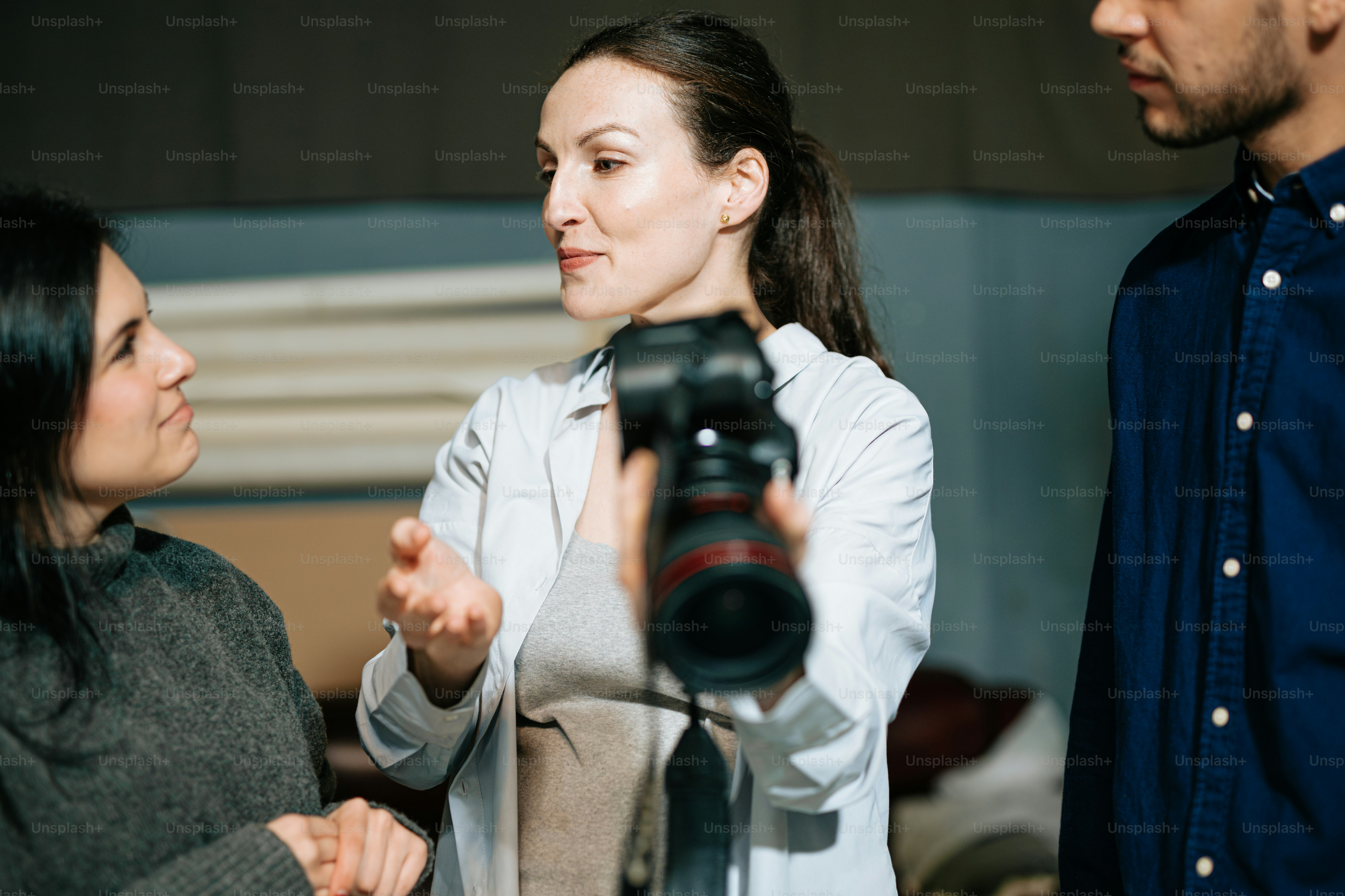 a woman taking a picture of a man with a camera