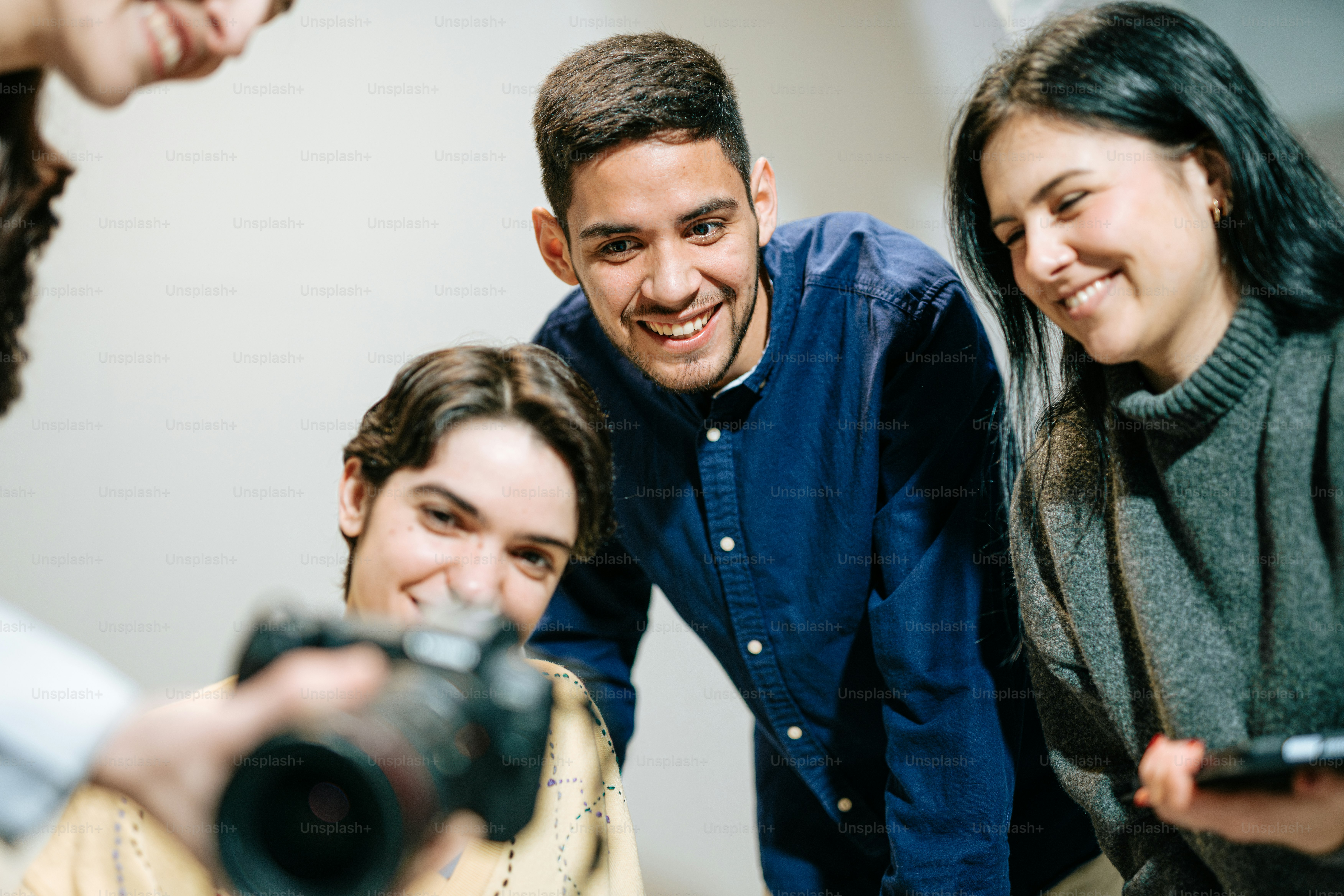 a group of people taking a picture with a camera